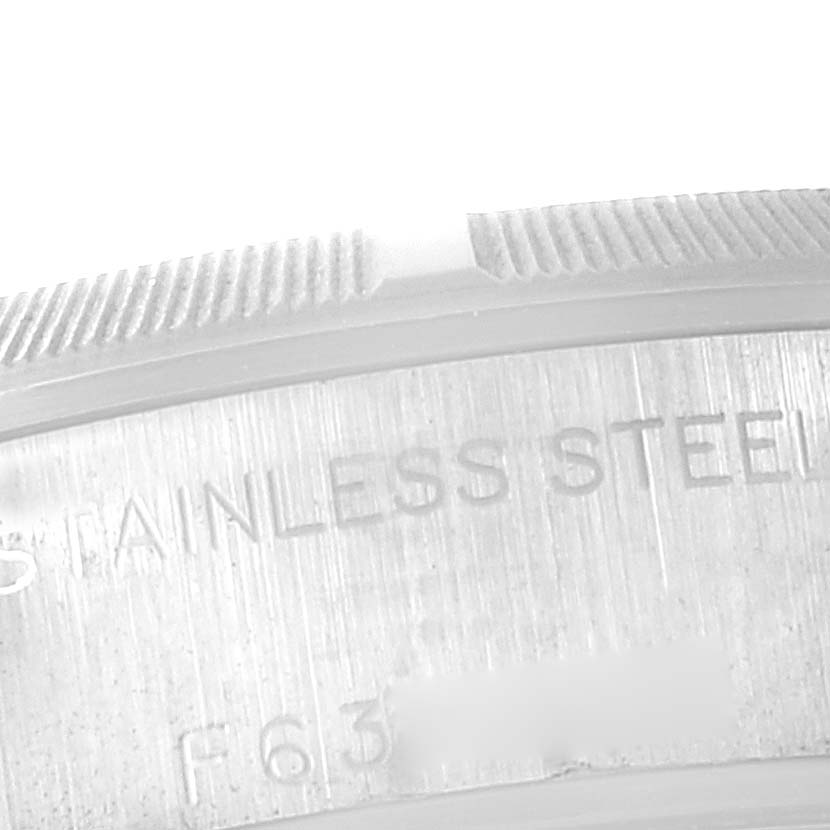 This image shows a close-up of the polished stainless steel case back and serrated bezel edge of a Rolex Date 79190 Women's Stainless Steel Silver Dial 79190 Women's Stainless Steel Silver Dial model.