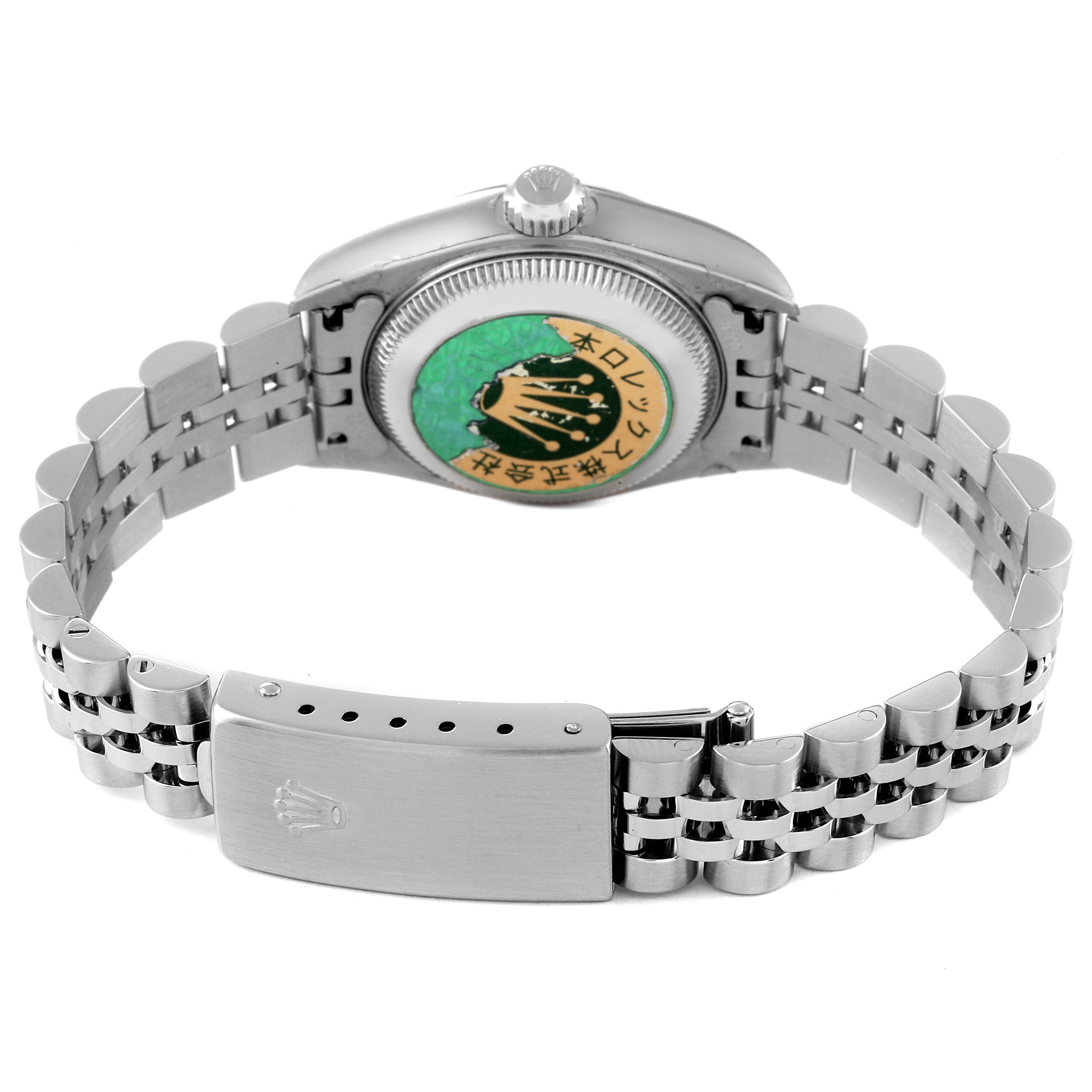 The image shows the back of a Rolex Datejust 79174 Women's Stainless Steel Silver Dial 79174 Women's Stainless Steel Silver Dial watch, highlighting the case back, crown, and metal bracelet with the clasp open.