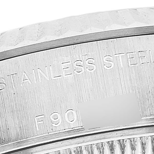 This image shows a close-up of the stainless steel casing with engravings of a Rolex Datejust 79174 Women's Stainless Steel Silver Dial 79174 Women's Stainless Steel Silver Dial model watch.