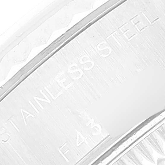 This image shows a close-up of the engraved text on the stainless steel case back of a Rolex Datejust 79174 Women's Stainless Steel Silver Dial 79174 Women's Stainless Steel Silver Dial watch.