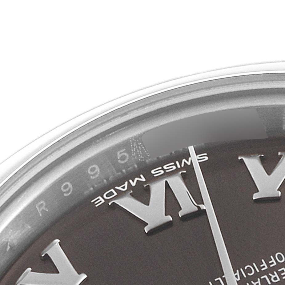 The image shows a close-up of a portion of the dial and bezel of a Rolex Datejust 279160 Women's Stainless Steel Brown Dial 279160 Women's Stainless Steel Brown Dial watch, featuring the Roman numeral VI and part of the Swiss Made markings.