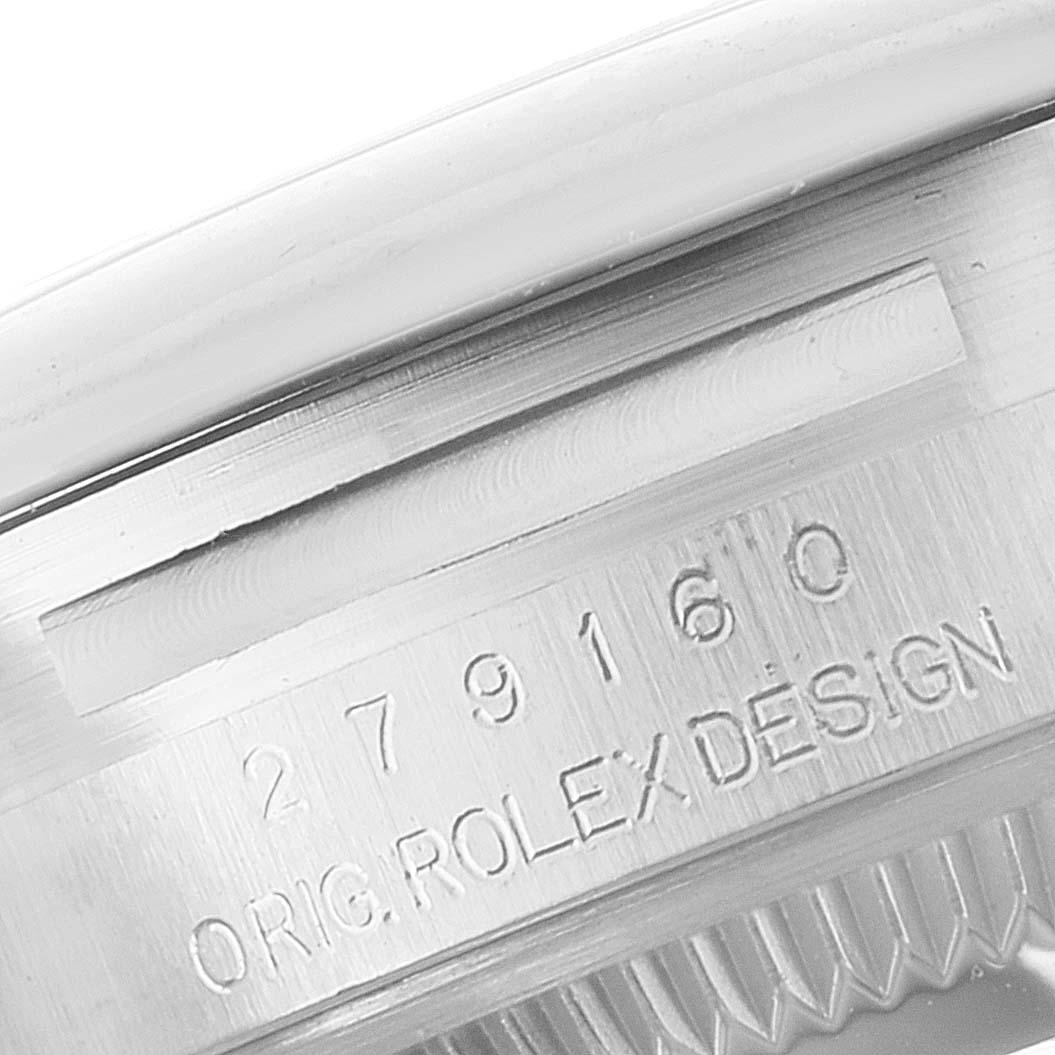 This image shows a close-up view of the serial number and engravings on the side of a Rolex Datejust 279160 Women's Stainless Steel Brown Dial 279160 Women's Stainless Steel Brown Dial watch case.