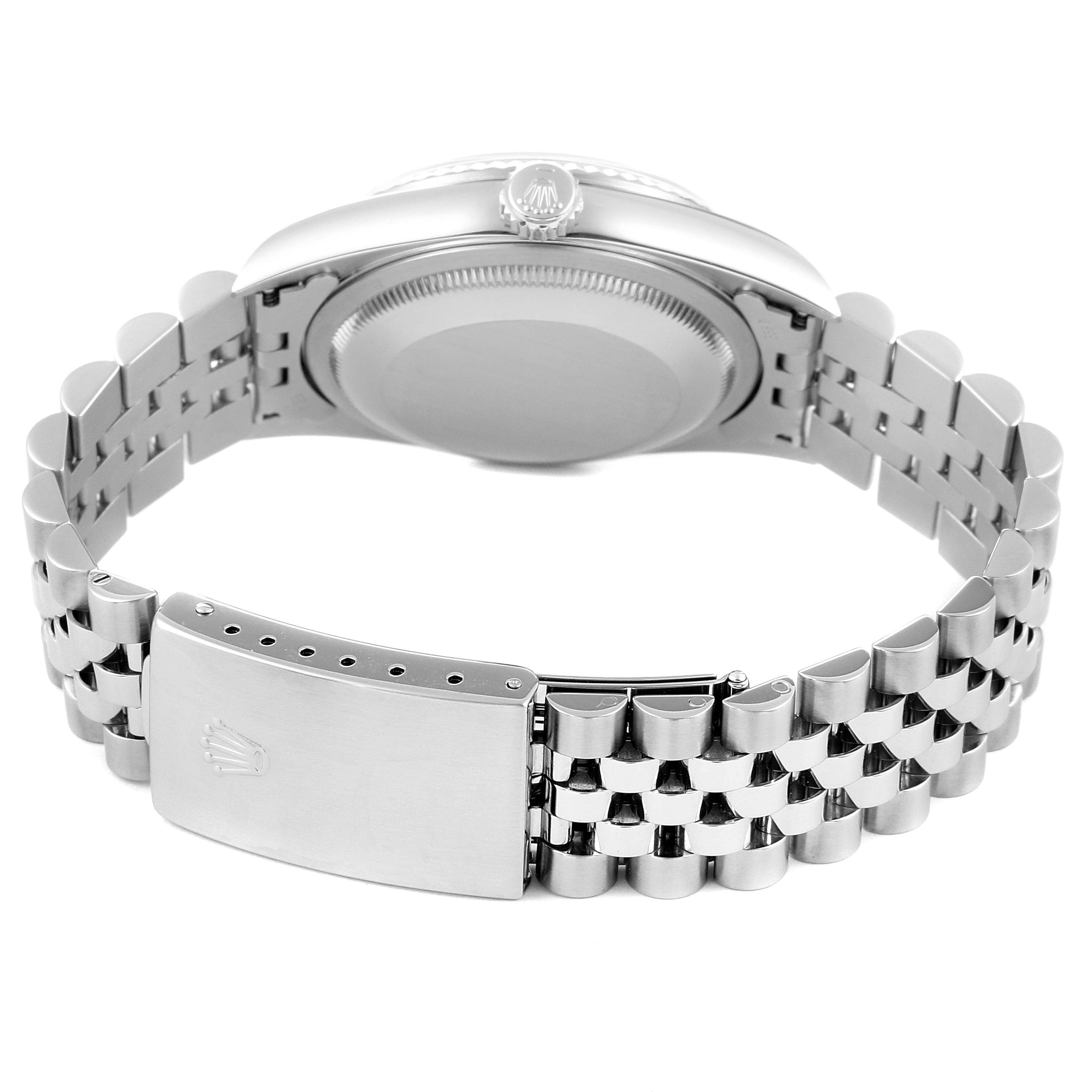 This image depicts the back case, crown, and bracelet clasp of a Rolex Datejust 16234 Men's Stainless Steel Pink Dial 16234 Men's Stainless Steel Pink Dial watch from a rear angle.