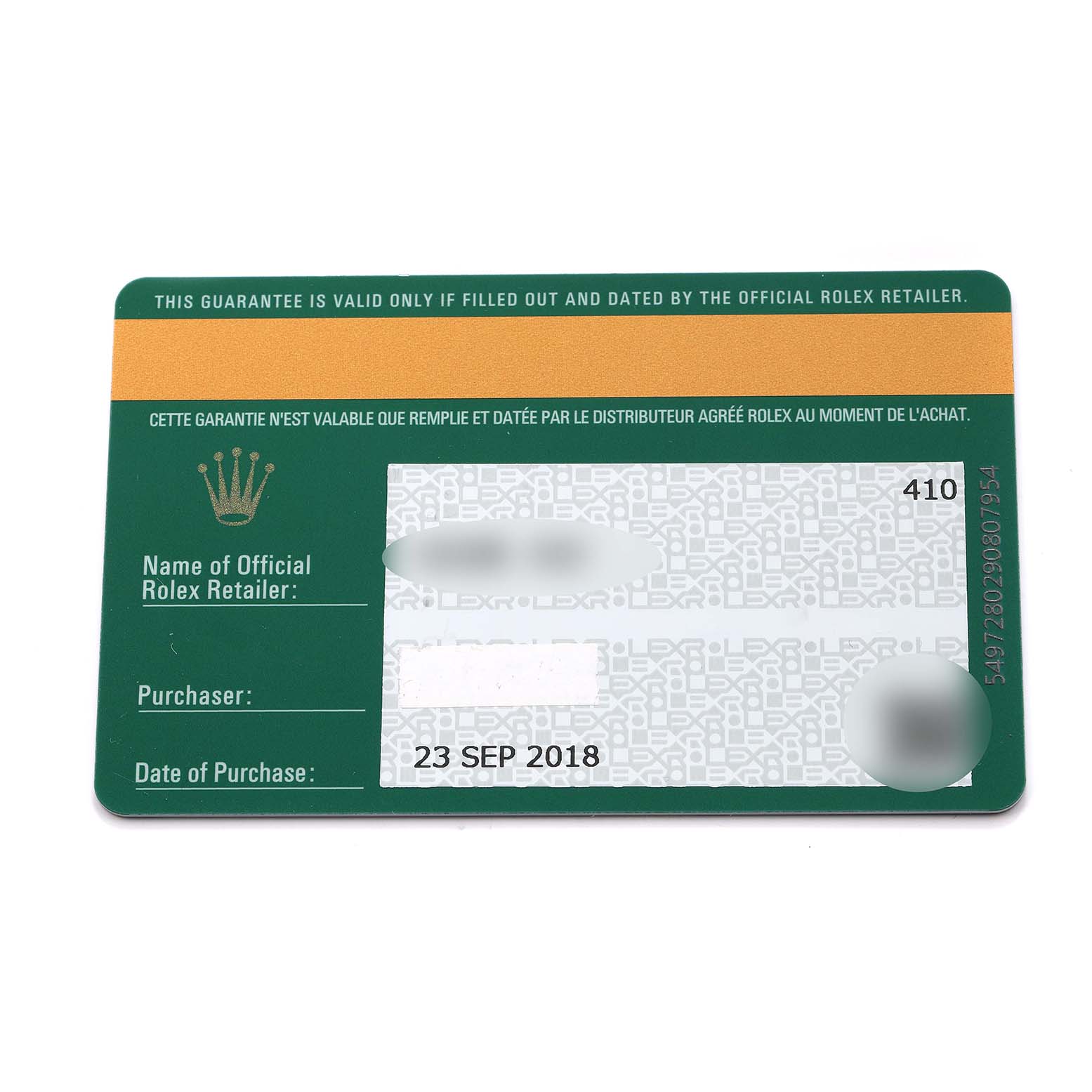 The image shows a close-up of a Rolex warranty card for a Mid-Size model, displaying purchase details and retailer information.
