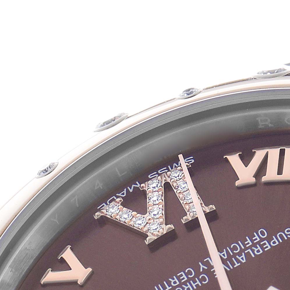 The image shows a close-up of a Rolex Mid-Size 178341 Women's Steel and Gold (two tone) Brown Dial model, highlighting the dial with Roman numerals and diamond embellishments.