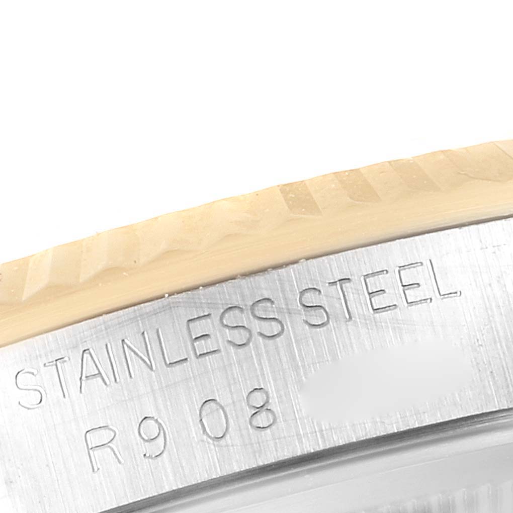 The image shows a close-up of the stainless steel bezel and part of the casing of the Rolex Datejust 16233 Men's Steel and Gold (two tone) Champagne Dial 16233 Men's Steel and Gold (two tone) Champagne Dial watch.