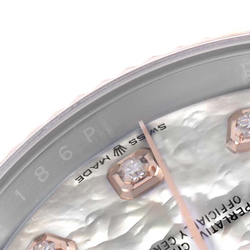 The image shows a close-up of the Rolex Datejust 126231 Men's Steel and Gold (two tone) Mother of Pearl Dial dial, highlighting diamond markers, a hand, and part of the "Swiss Made" text.