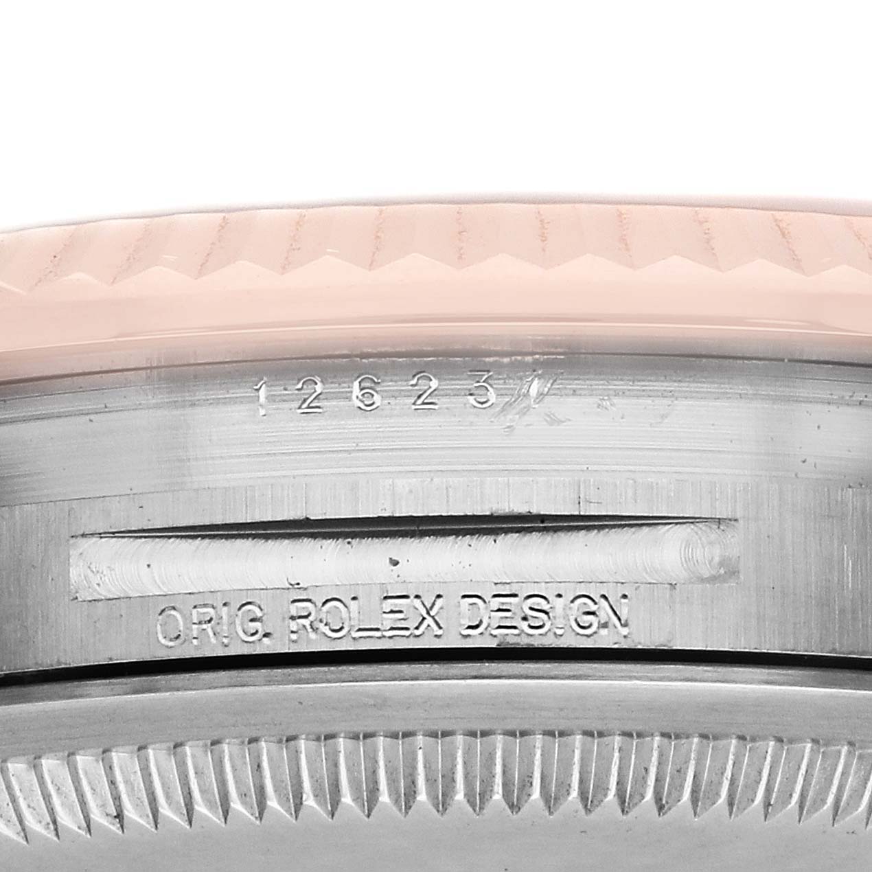 The image shows a close-up of the Rolex Datejust 126231 Men's Steel and Gold (two tone) Mother of Pearl Dial model's bezel and case, highlighting the model number and "ORIG. ROLEX DESIGN" engraving.