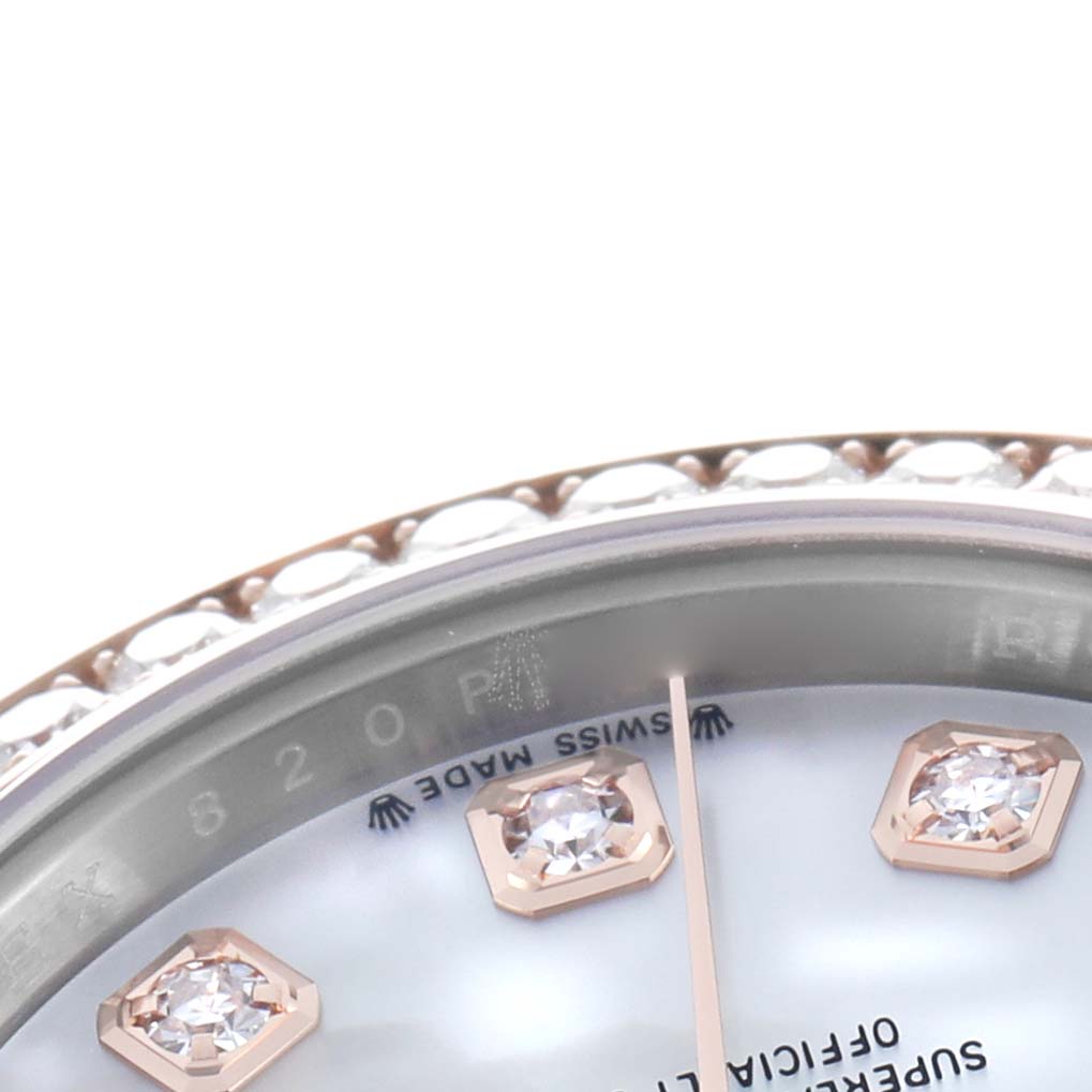 The image shows a close-up of the Rolex Datejust 279381 Women's Steel and Gold (two tone) Mother of Pearl Dial watch's diamond hour markers, dial edge, and bezel from an angled side view.