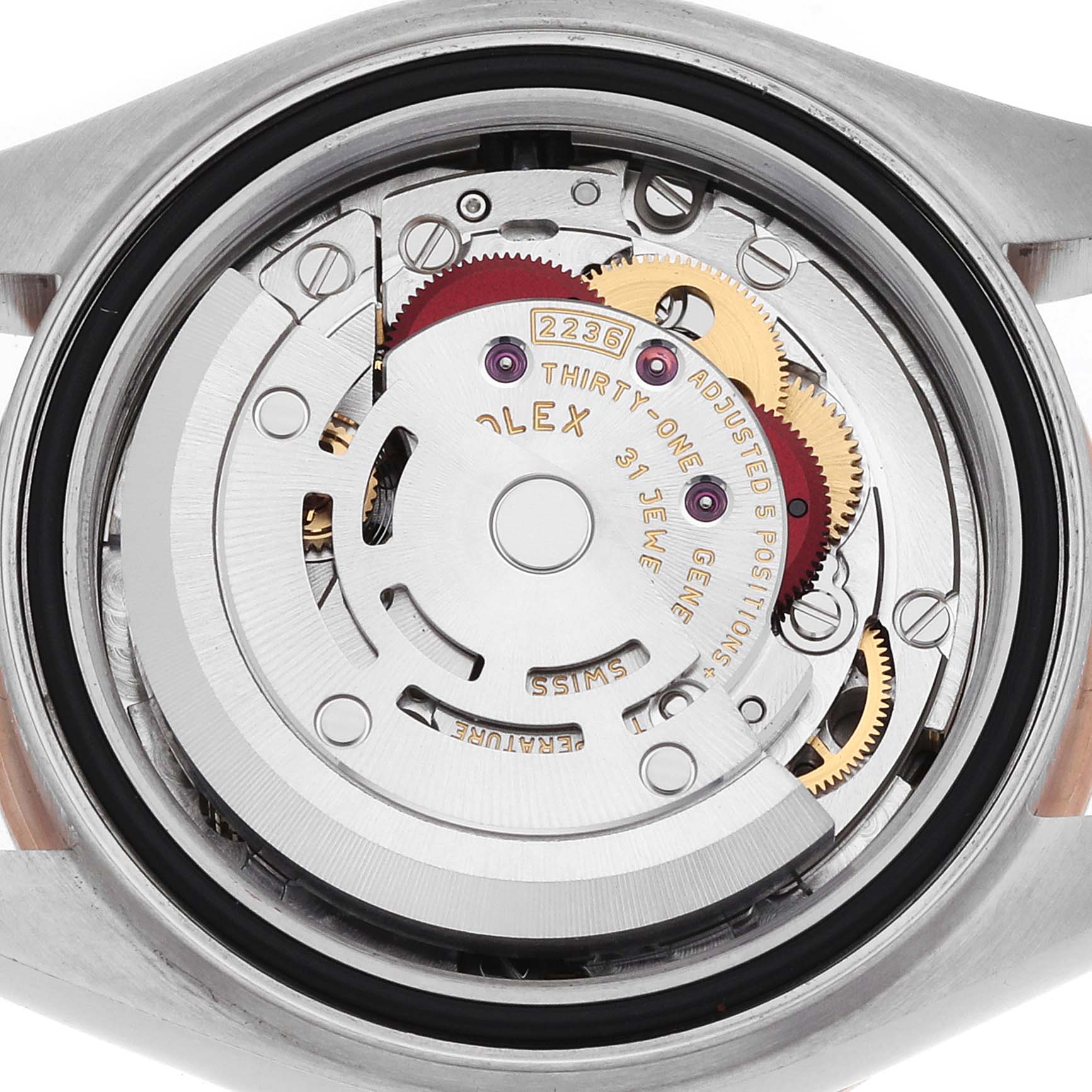 The image shows the movement of a Rolex Datejust 279381 Women's Steel and Gold (two tone) Mother of Pearl Dial watch from the back, focusing on gears and the rotor.