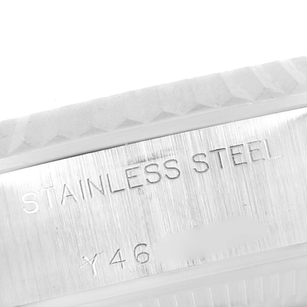This image shows a close-up of the stainless steel inscription and edge of the bezel on a Rolex Datejust 79174 Women
s Stainless Steel Silver Dial 79174 Women
s Stainless Steel Silver Dial watch.