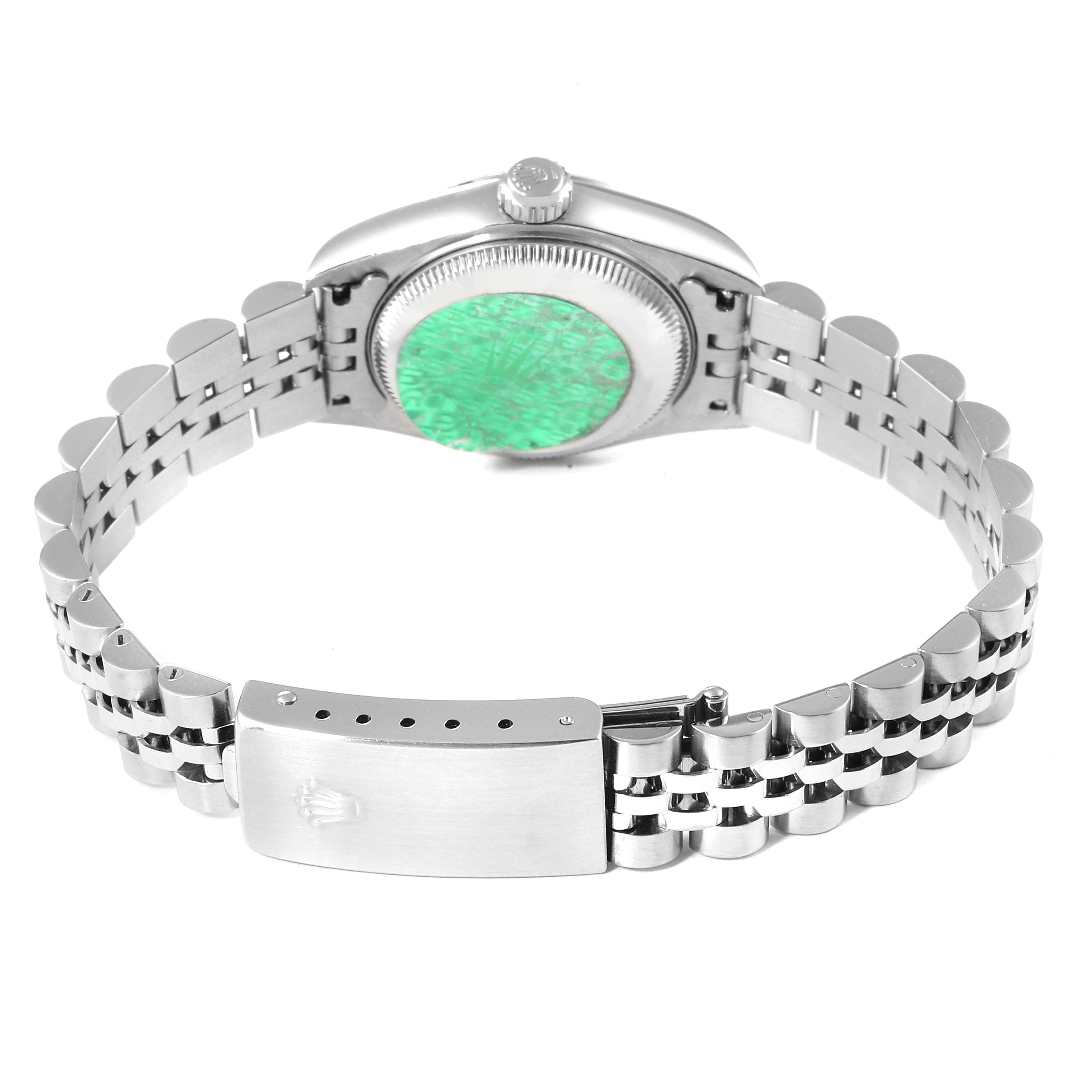 The image shows the back view of a Rolex Datejust 79174 Women
s Stainless Steel Silver Dial 79174 Women
s Stainless Steel Silver Dial watch, focusing on its open clasp and metal bracelet.