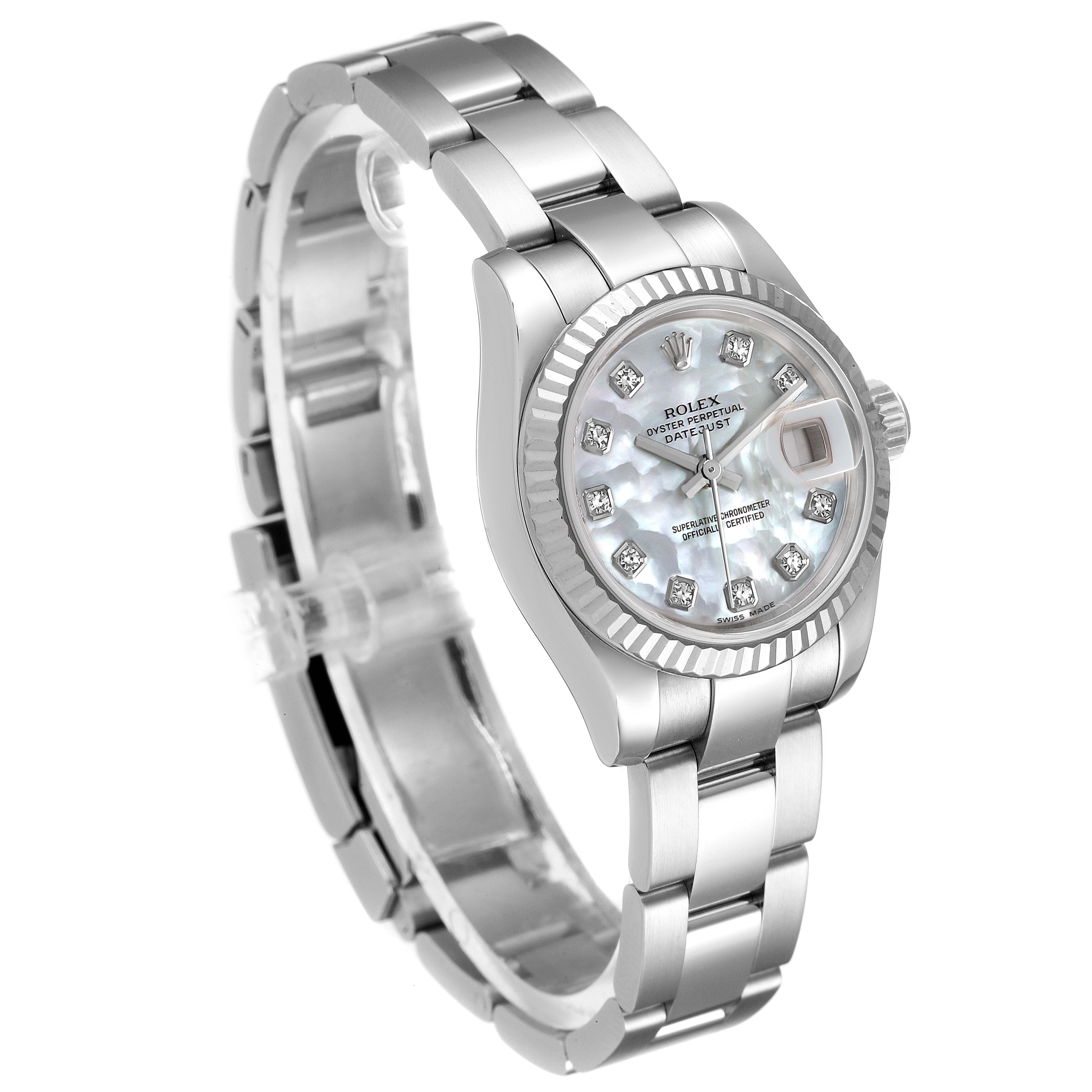 The image shows a Rolex Datejust 179174 Women
s Stainless Steel Mother of Pearl Dial 179174 Women
s Stainless Steel Mother of Pearl Dial watch from an angled side view, highlighting the bracelet, dial, and fluted bezel.