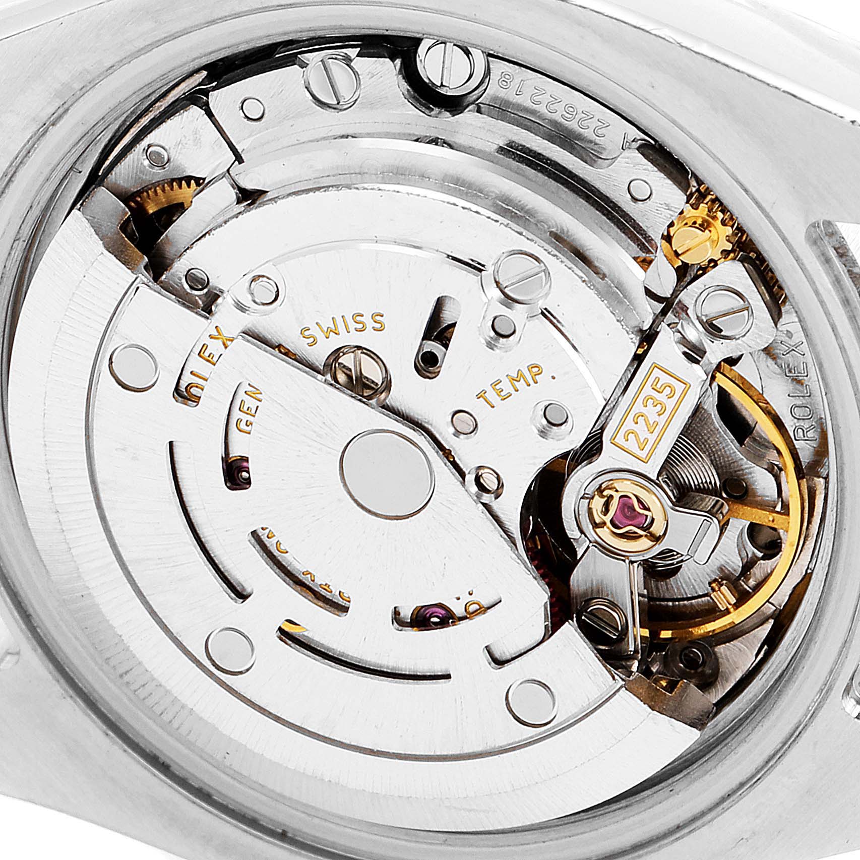 Close-up of the movement mechanism of a Rolex Datejust 179174 Women
s Stainless Steel Mother of Pearl Dial 179174 Women
s Stainless Steel Mother of Pearl Dial watch, showing gears and components clearly.