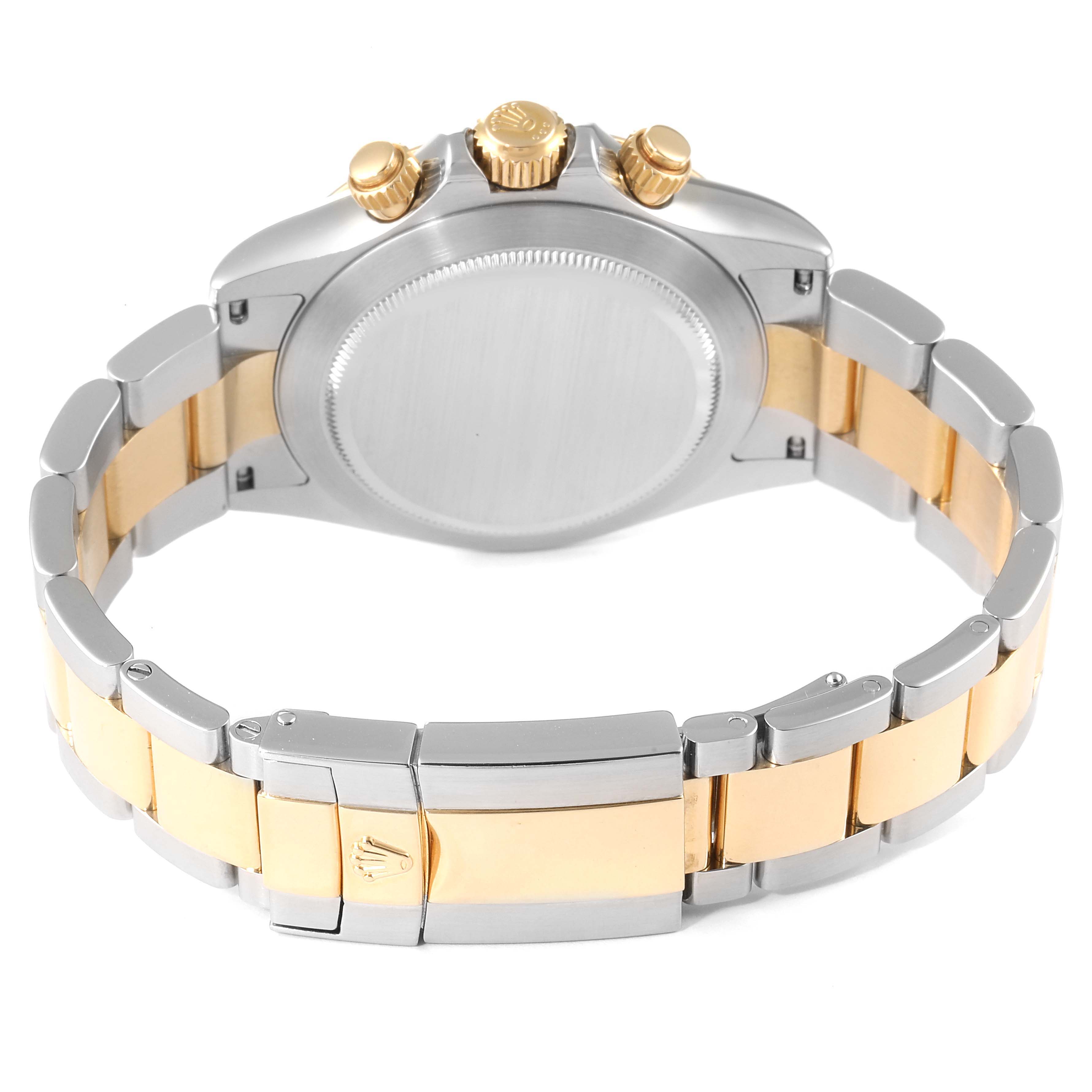 The image shows the back view of a Rolex Daytona 116523 Men's Steel and Gold (two tone) Champagne Dial 116523 Men's Steel and Gold (two tone) Champagne Dial watch, highlighting its case back, crown, and two-tone bracelet.