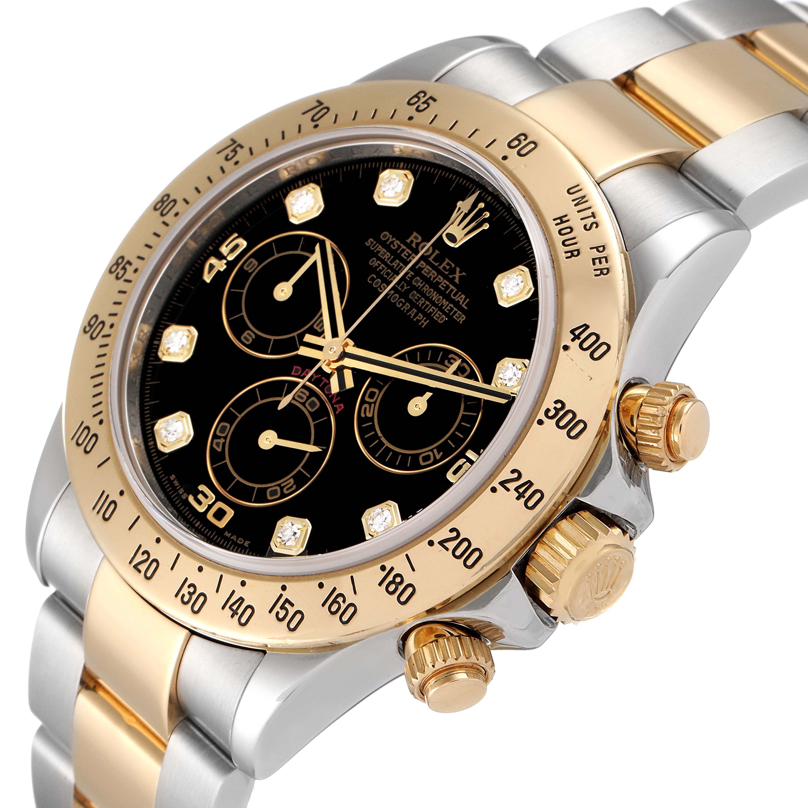 This image shows a close-up angle of the Rolex Daytona 116523 Men
s Steel and Gold (two tone) Black Dial 116523 Men
s Steel and Gold (two tone) Black Dial watch, highlighting the bezel, crown, pushers, and part of the bracelet.