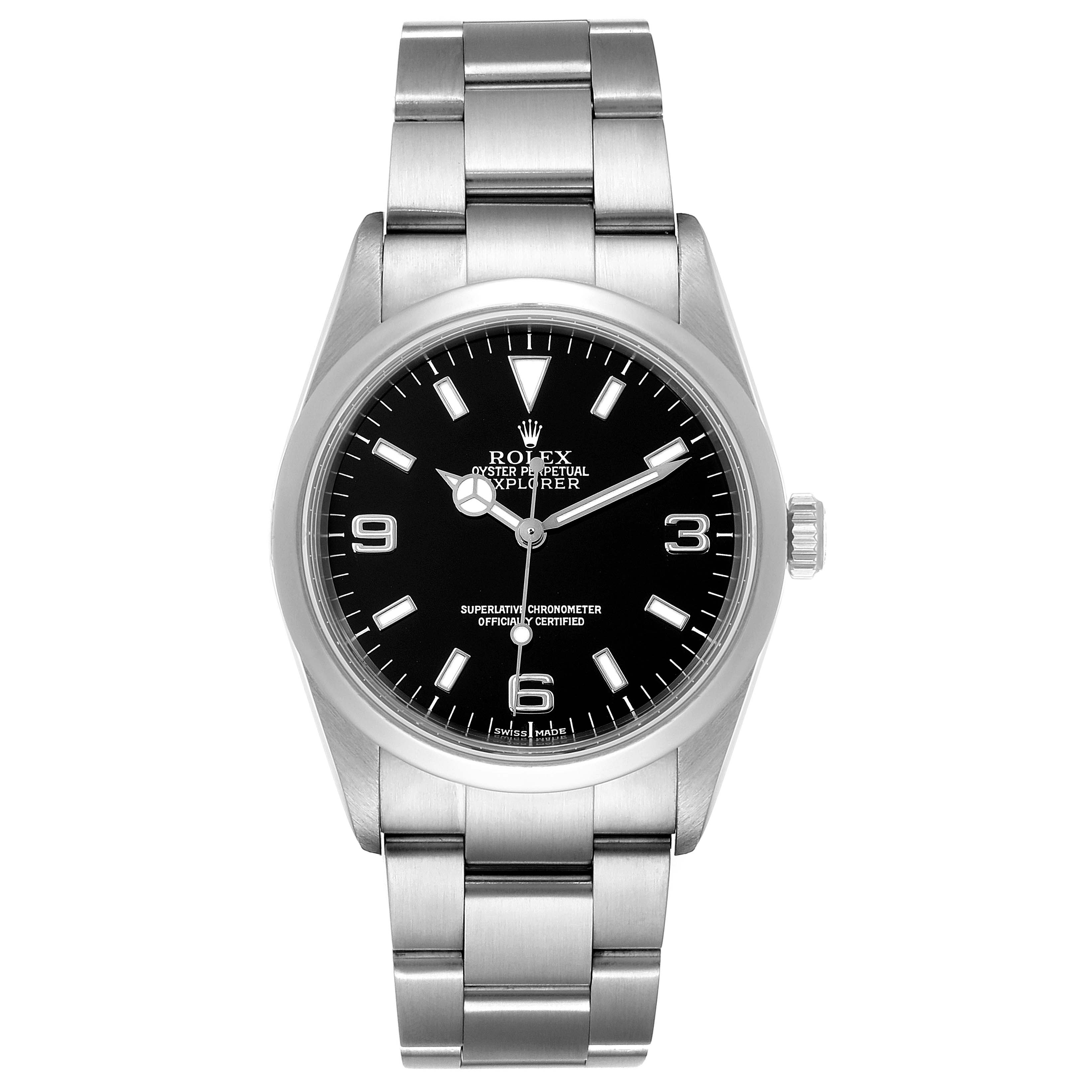 The Rolex Explorer 114270 Men
s Stainless Steel Black Dial 114270 Men
s Stainless Steel Black Dial watch is shown from a top-down angle, displaying its face, bezel, crown, and bracelet.