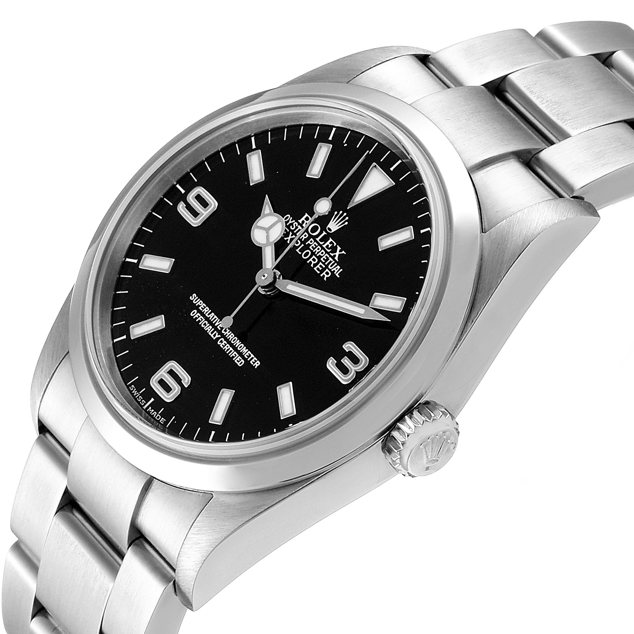 The image shows a close-up angled view of the Rolex Explorer 114270 Men
s Stainless Steel Black Dial 114270 Men
s Stainless Steel Black Dial watch, highlighting the dial, crown, and part of the bracelet.