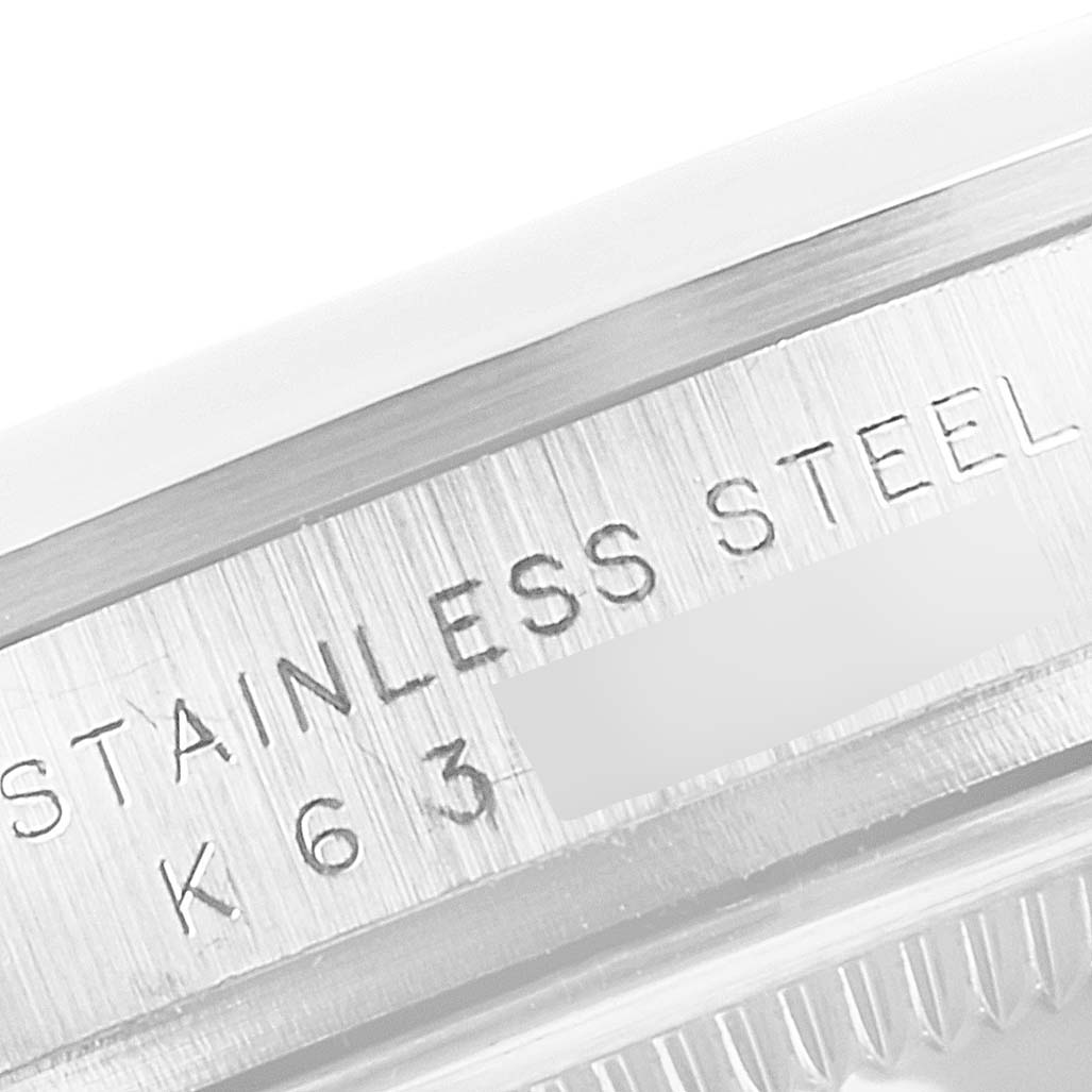 This is a close-up of the case back of the Rolex Explorer 114270 Men
s Stainless Steel Black Dial 114270 Men
s Stainless Steel Black Dial, showing the "STAINLESS STEEL" engraving.