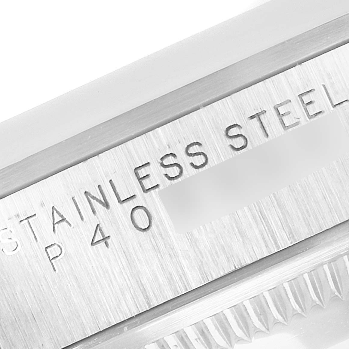 The image shows a close-up view of the side of the Rolex Explorer 14270 Men
s Stainless Steel Black Dial 14270 Men
s Stainless Steel Black Dial watch, focusing on the engraving "STAINLESS STEEL".