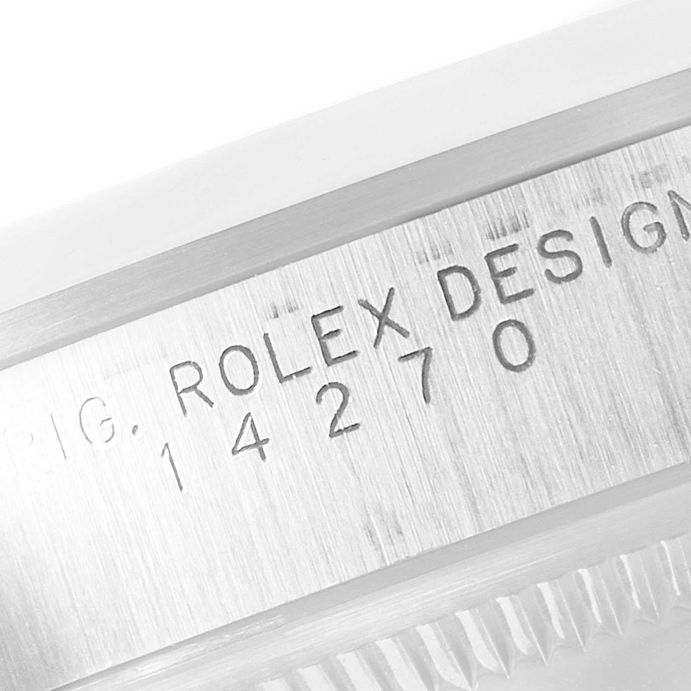 The image shows a close-up of the serial number engraving on the case of a Rolex Explorer 14270 Men
s Stainless Steel Black Dial 14270 Men
s Stainless Steel Black Dial watch.