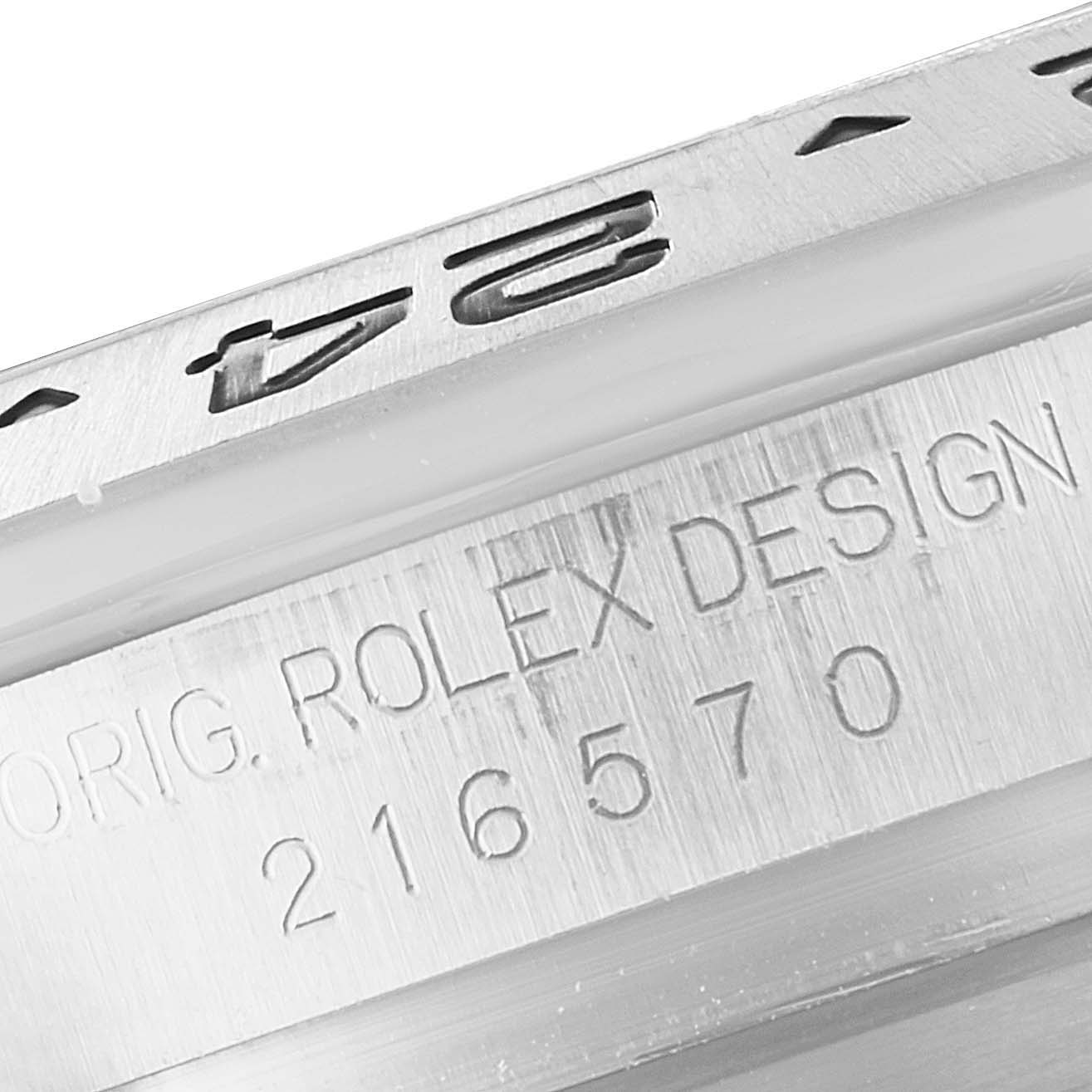 The image shows a close-up of the side engraving on a Rolex Explorer 216570 Men
s Stainless Steel Black Dial 216570 Men
s Stainless Steel Black Dial watch, including the model number 216570.