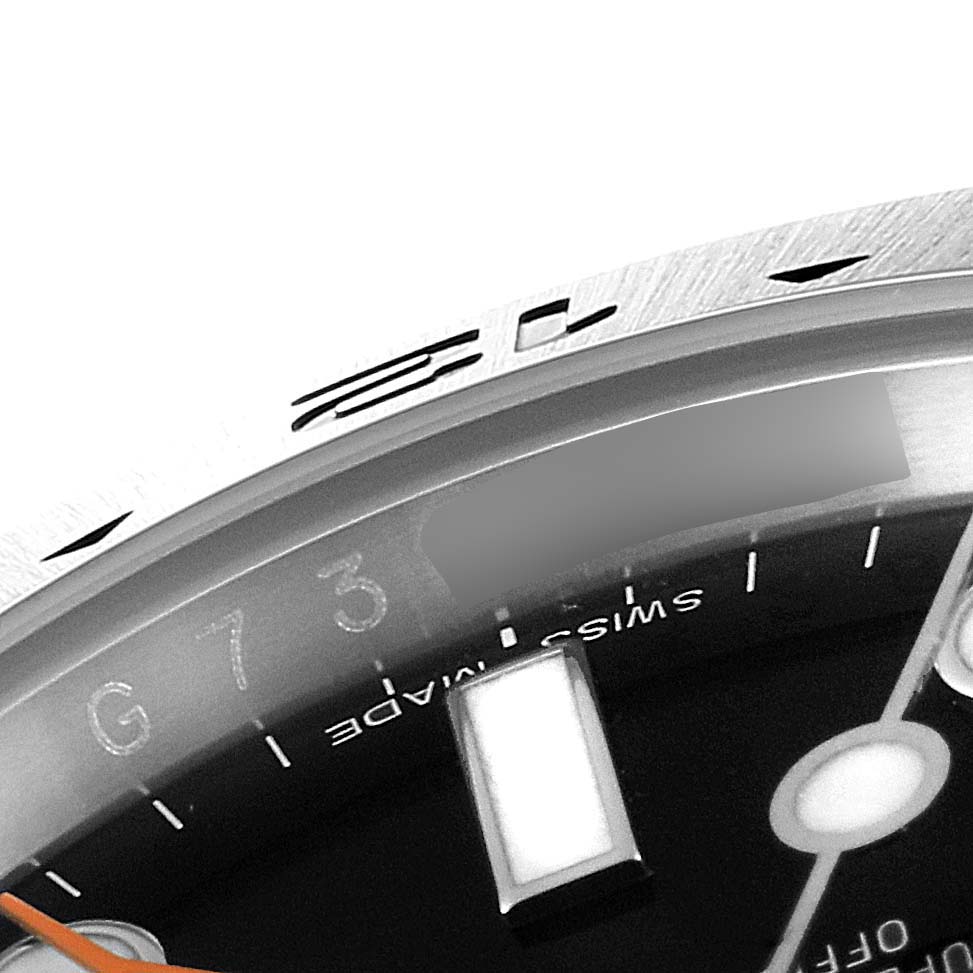 The image shows a close-up angle of the bezel and part of the dial of a Rolex Explorer 216570 Men
s Stainless Steel Black Dial 216570 Men
s Stainless Steel Black Dial watch.