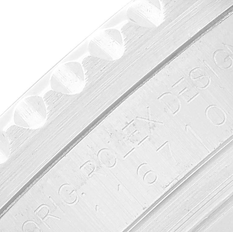 This close-up image shows the engraved details on the side of the bezel of a Rolex GMT-Master 116710 Men's Stainless Steel Black Dial 116710 Men's Stainless Steel Black Dial watch.