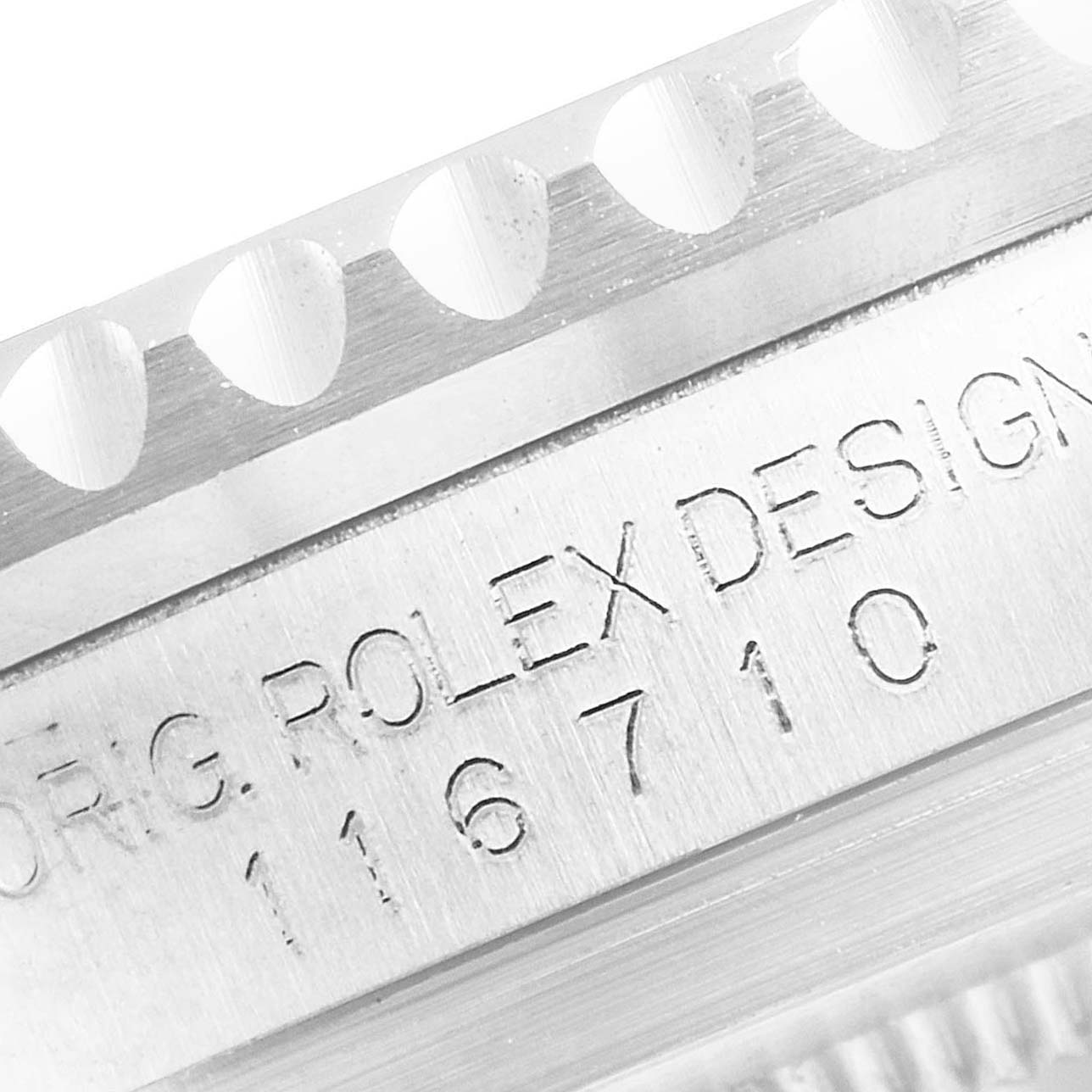 The image shows a close-up of the case and bezel with the serial number of a Rolex GMT-Master 116710 Men
s Stainless Steel Black Dial 116710 Men
s Stainless Steel Black Dial watch.