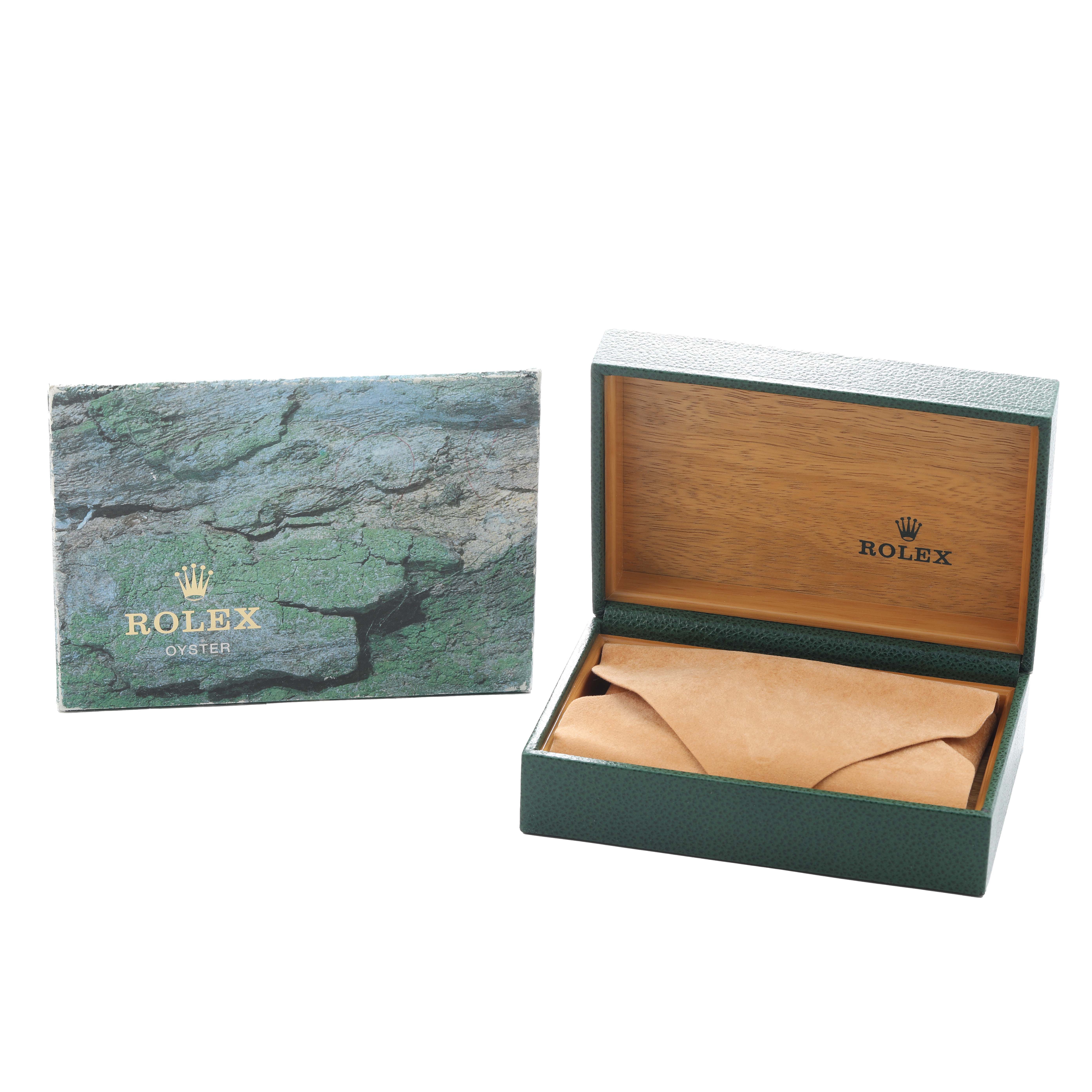 The image shows a Rolex GMT-Master 16710 Men's Stainless Steel Black Dial packaging, including an open green watch box and outer box with the brand's logo.