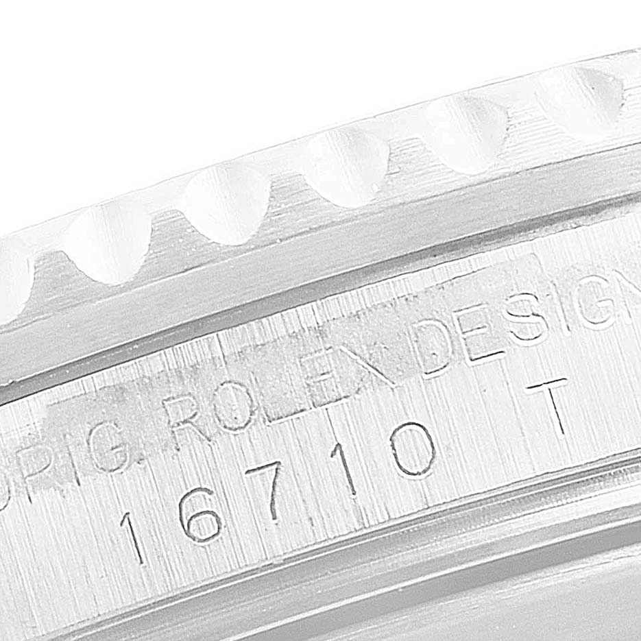 This image shows a close-up of the engraved case side of a Rolex GMT-Master 16710 Men
s Stainless Steel Black Dial 16710 Men
s Stainless Steel Black Dial, model number 16710.