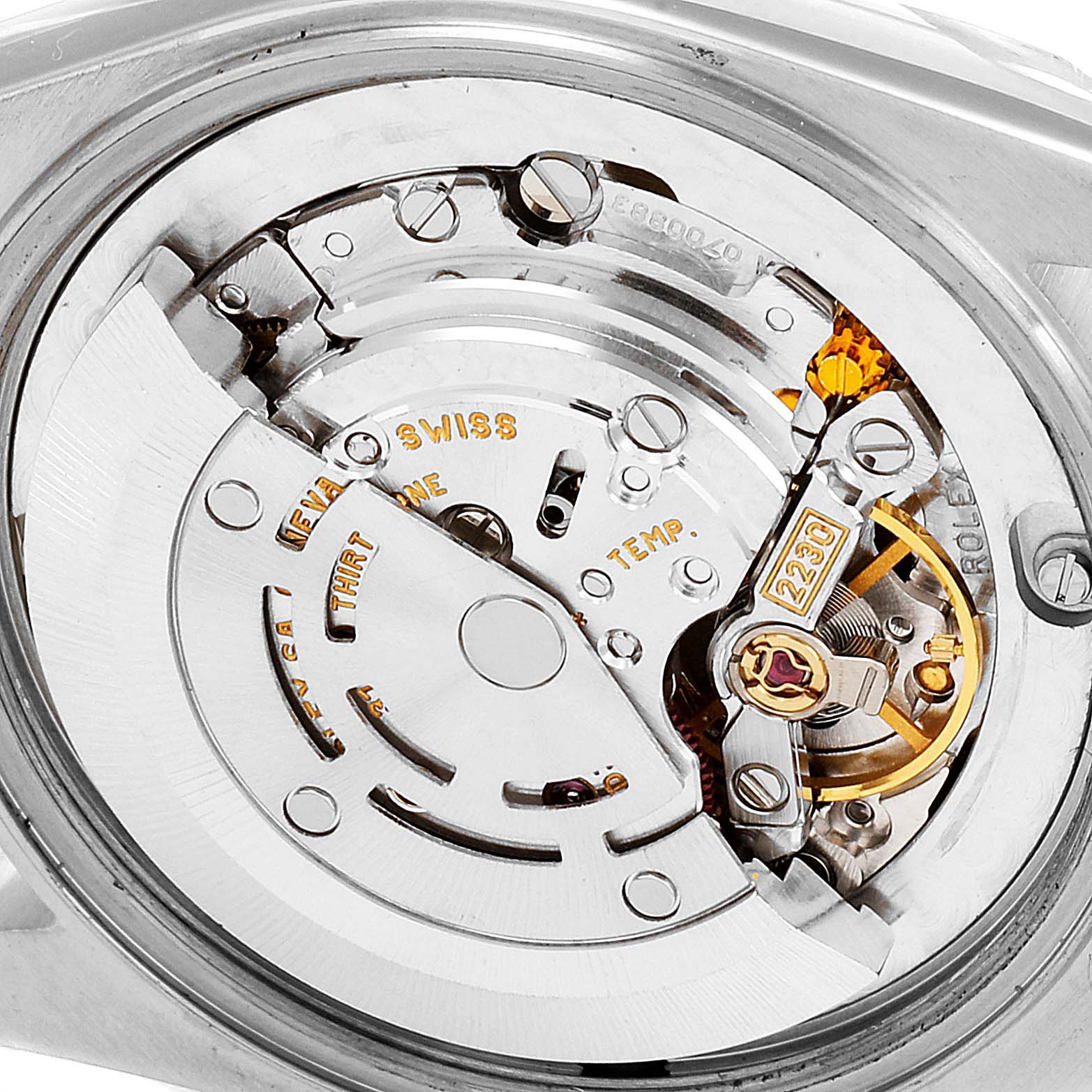 This image shows a close-up view of the internal movement mechanism of a Mid-Size Rolex watch.