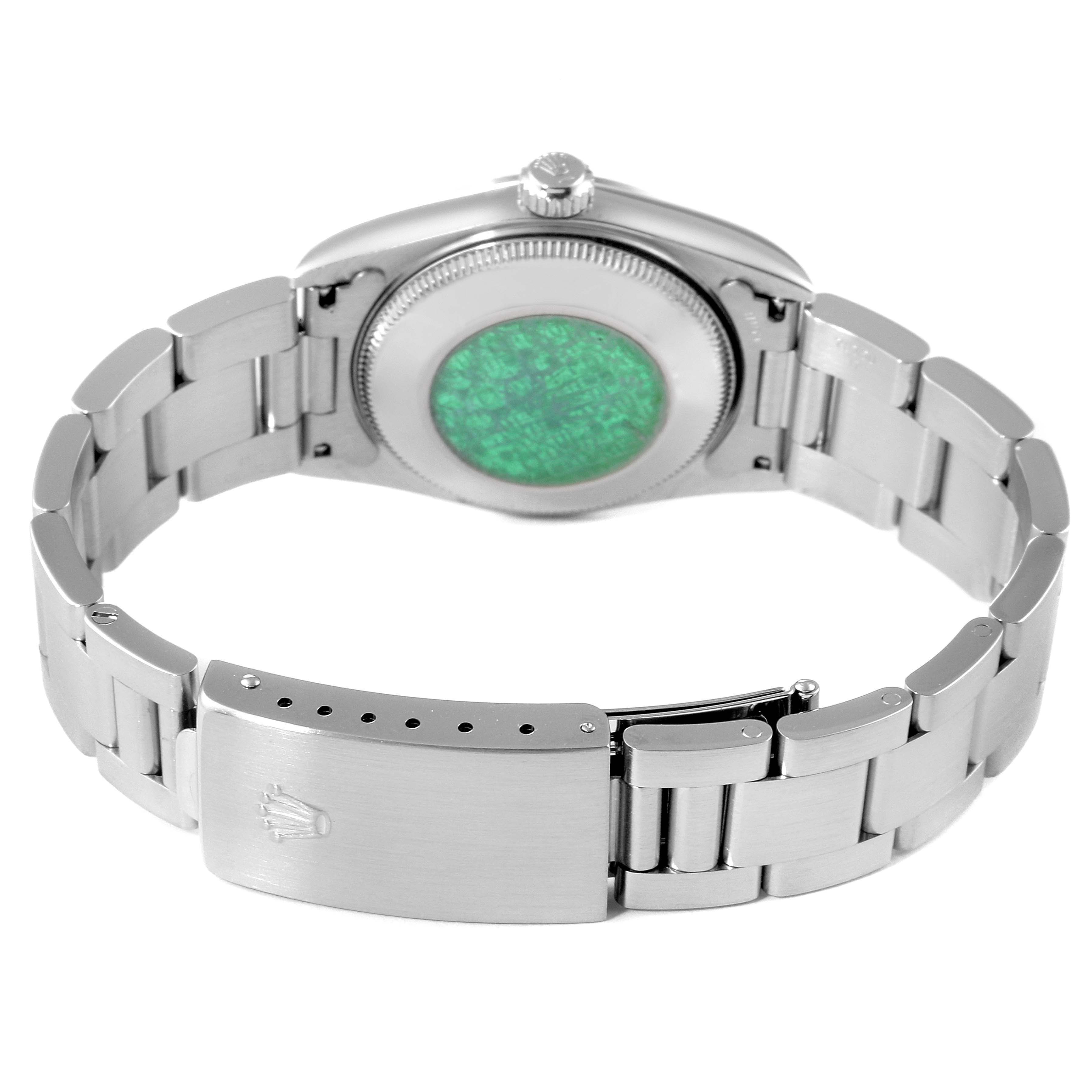 The image shows the back view of a Rolex Mid-Size 77080 Women
s Stainless Steel White Dial 77080 Women
s Stainless Steel White Dial watch, highlighting the clasp, bracelet, and case back.