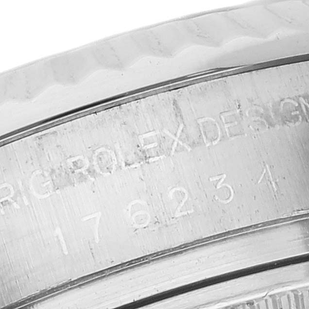 The image shows a close-up of the engraved case and bezel of a Rolex Oyster Perpetual 176234 Women's Stainless Steel White Dial 176234 Women's Stainless Steel White Dial watch.