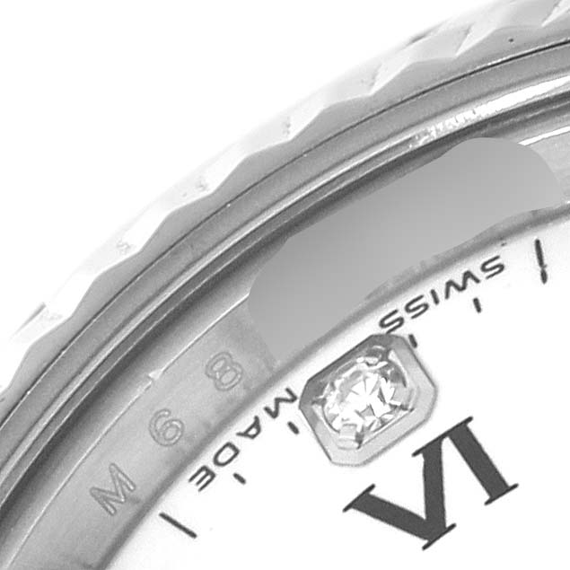 This close-up angle of the Rolex Oyster Perpetual 176234 Women's Stainless Steel White Dial 176234 Women's Stainless Steel White Dial watch shows the dial near the VI marker and part of the bezel with diamond detailing.