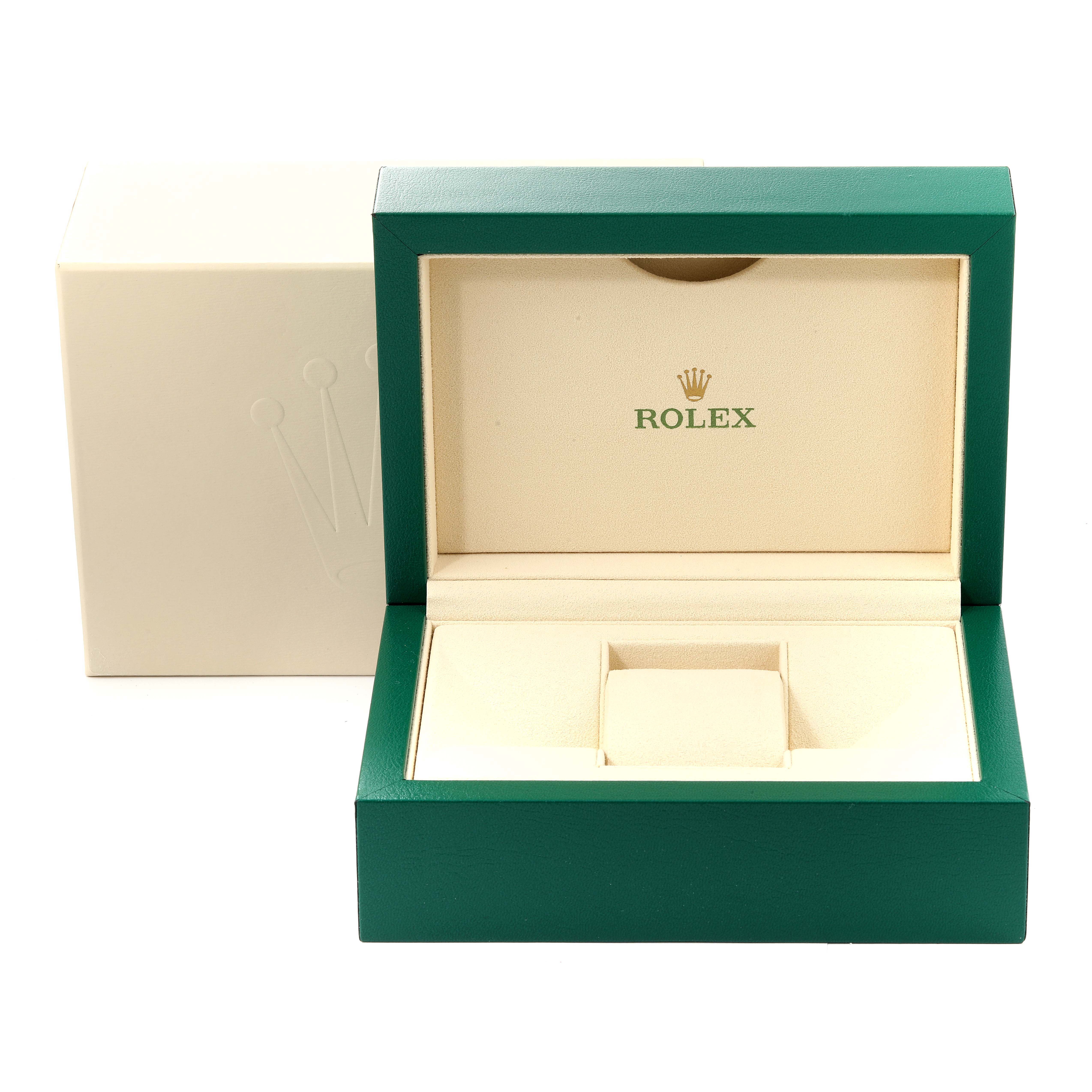 The image shows the open green and beige Rolex box for the Oyster Perpetual model, revealing its interior watch cushion and exterior box.