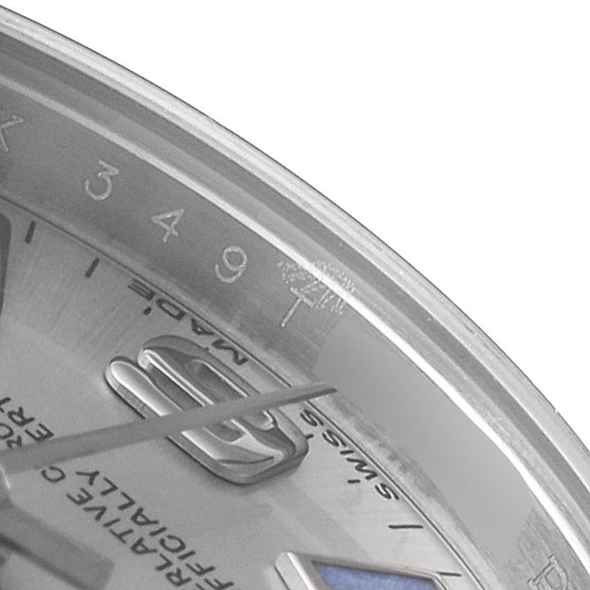 The image shows a close-up angle of the dial and bezel of a Rolex Oyster Perpetual 176200 Women's Stainless Steel Silver Dial 176200 Women's Stainless Steel Silver Dial watch, highlighting the numerals and part of the watch hand.
