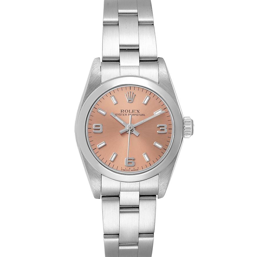 The image shows a frontal view of the Rolex Oyster Perpetual watch displaying its peach-colored dial and stainless steel bracelet.