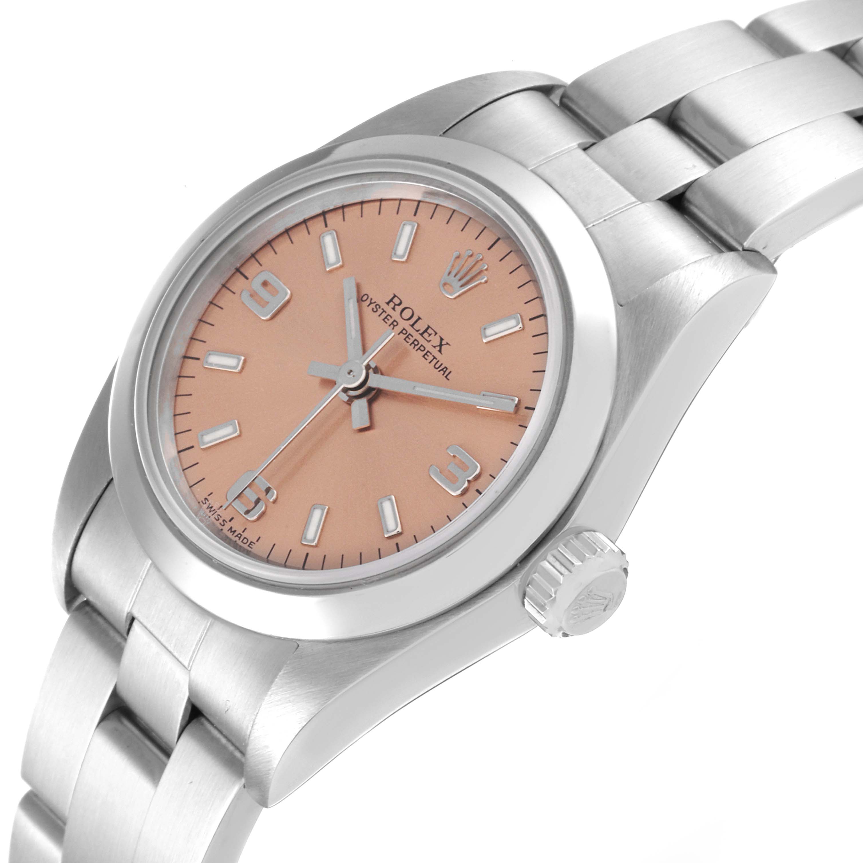 The Rolex Oyster Perpetual 76080 Women
s Stainless Steel Pink Dial 76080 Women
s Stainless Steel Pink Dial watch is shown at a slight angle displaying its pink dial, hour markers, crown, and stainless steel bracelet.