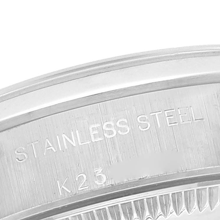 This image shows a close-up of the side engraving on a stainless steel Rolex Oyster Perpetual 76080 Women
s Stainless Steel Pink Dial 76080 Women
s Stainless Steel Pink Dial watch.