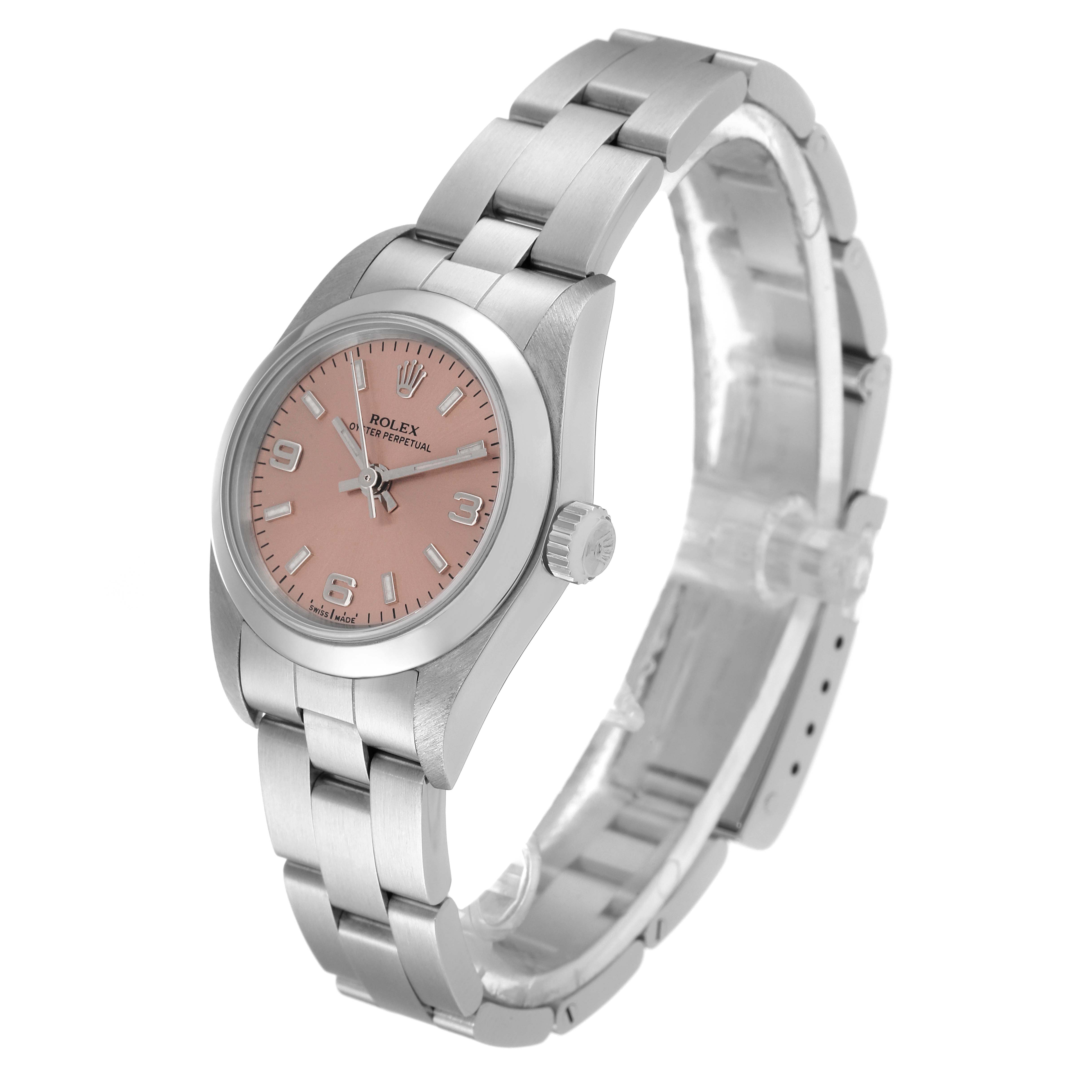 The Rolex Oyster Perpetual 76080 Women
s Stainless Steel Pink Dial 76080 Women
s Stainless Steel Pink Dial watch is shown at an angle displaying the dial, bracelet, and side crown.