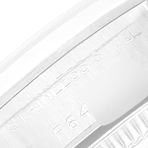 The image shows a close-up of the stainless steel part of a Rolex Oyster Perpetual 76080 Women
s Stainless Steel Pink Dial 76080 Women
s Stainless Steel Pink Dial watch, focusing on the engraved text.