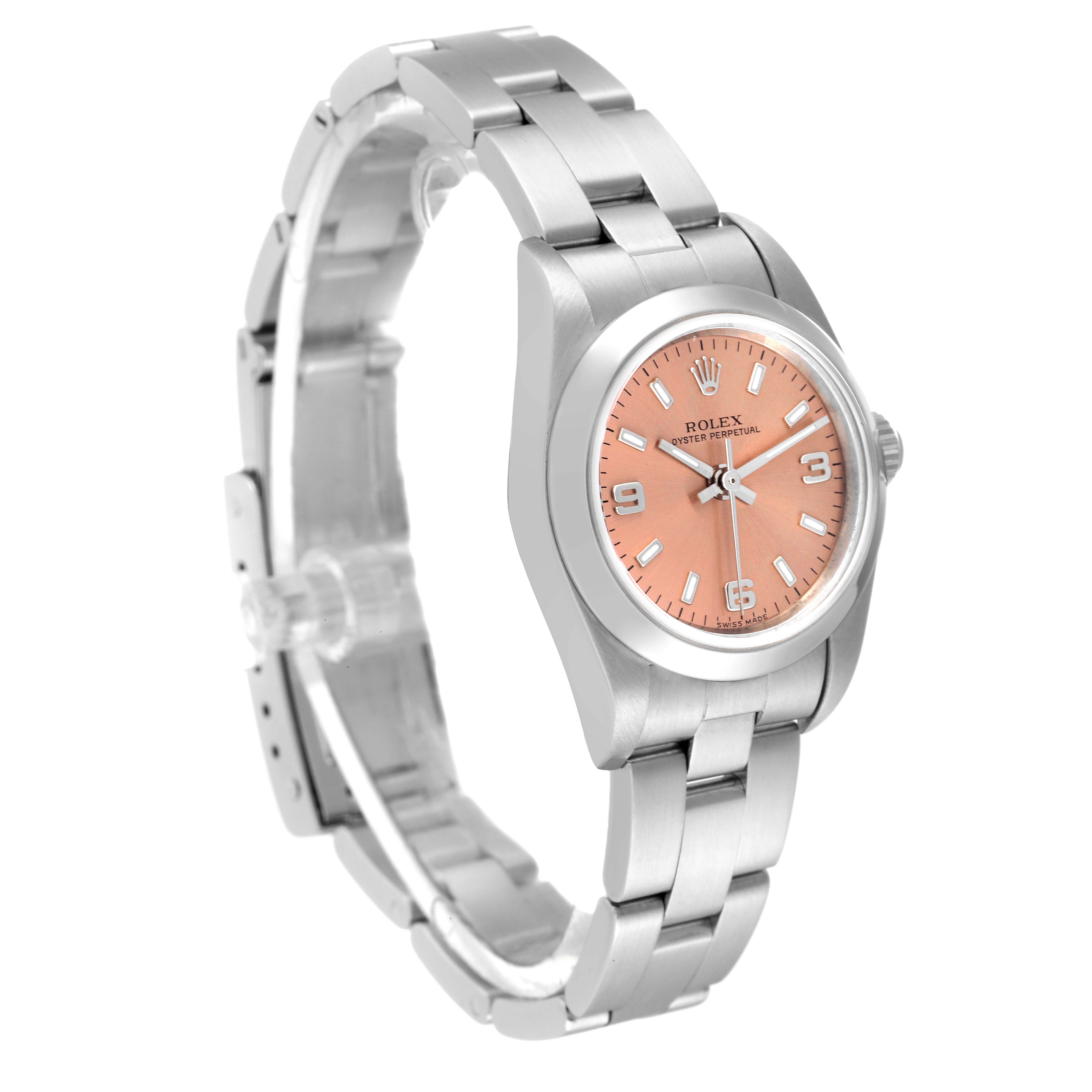 This Rolex Oyster Perpetual 76080 Women
s Stainless Steel Pink Dial 76080 Women
s Stainless Steel Pink Dial watch is shown at a three-quarter angle, displaying its face, bracelet, and clasp.