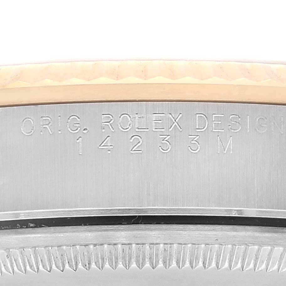 This image displays the engraved case side of a Rolex Oyster Perpetual 14233 Men's Steel and Gold (two tone) Black Dial 14233 Men's Steel and Gold (two tone) Black Dial with the model number 14233M.