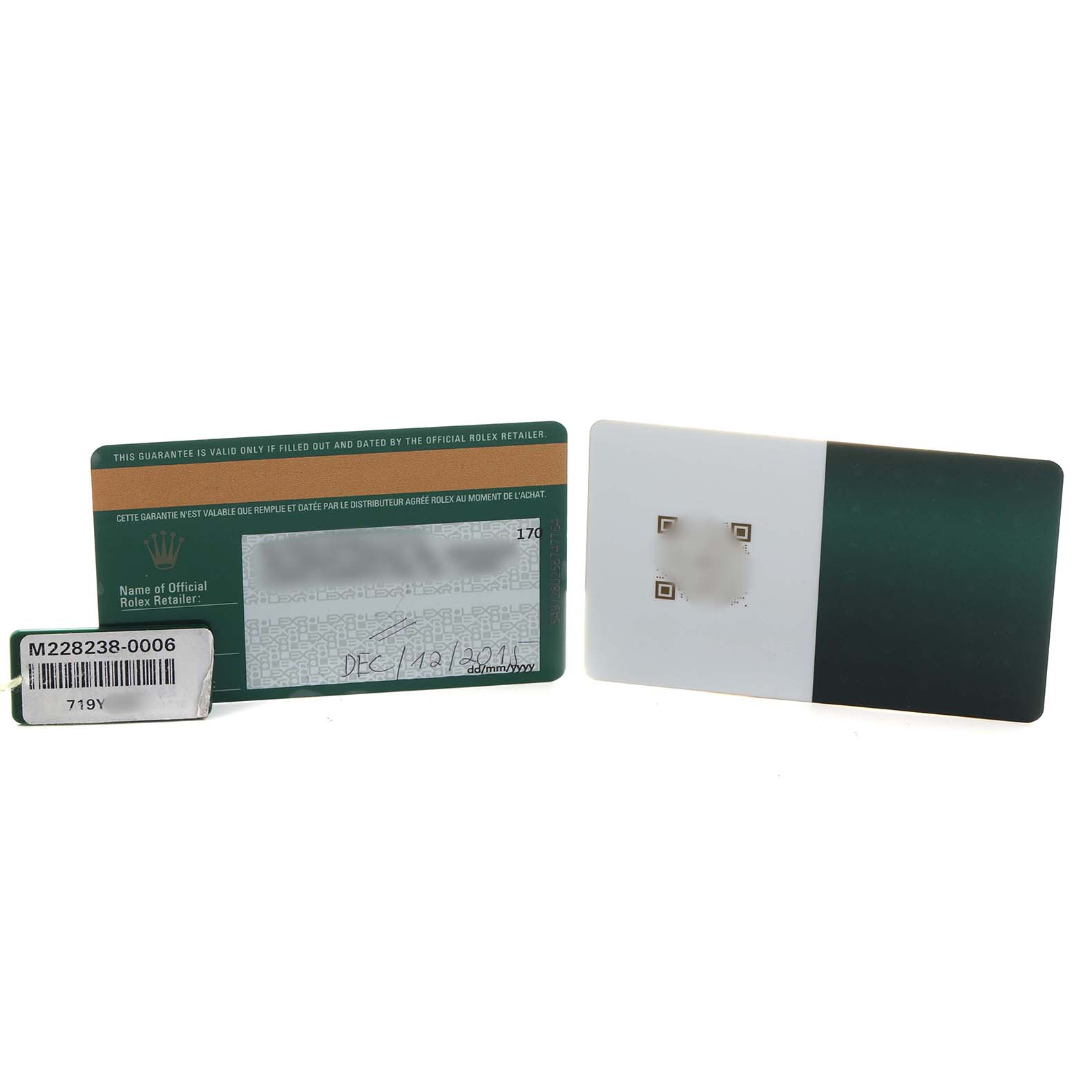 The image shows warranty cards and a tag for a Rolex President 228238 Men's Yellow Gold Champagne Dial watch, viewed from the front.