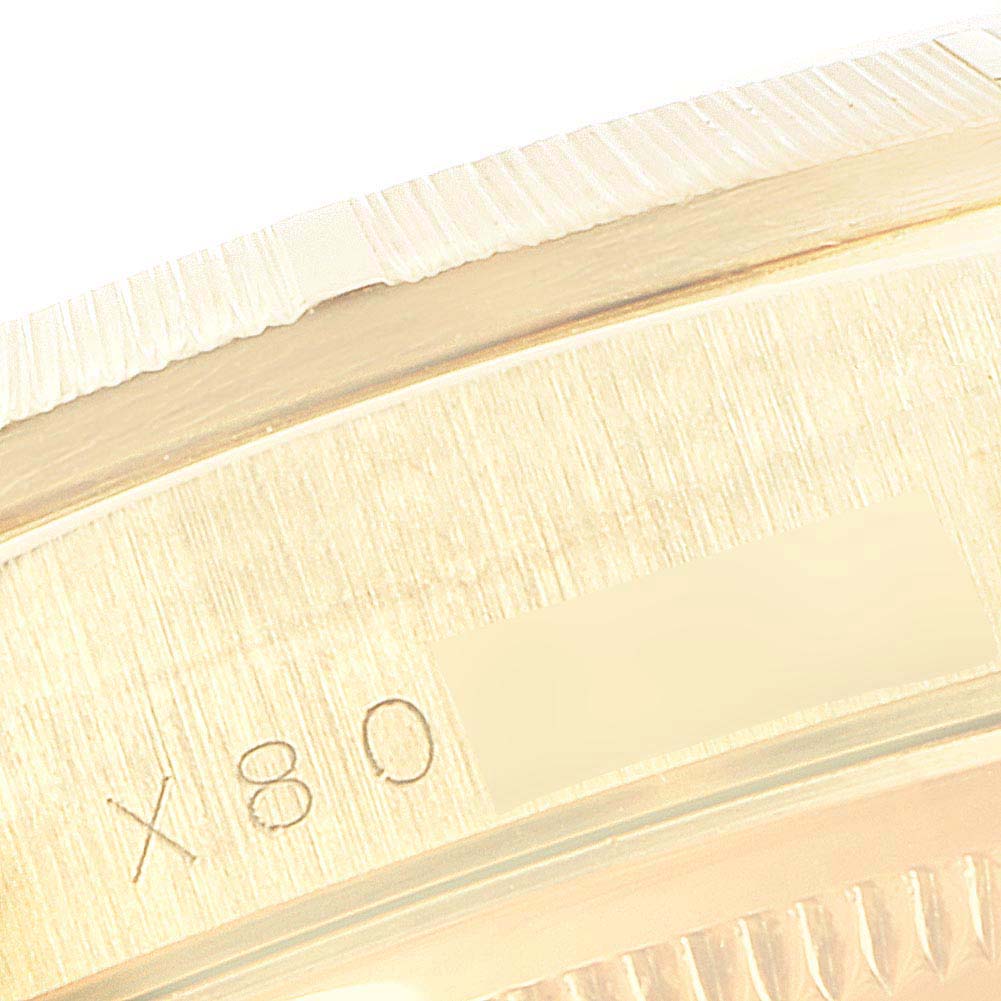 This image shows a close-up of the gold bezel and bracelet of a Rolex President 18248 Men's Yellow Gold Champagne Dial 18248 Men's Yellow Gold Champagne Dial model watch.