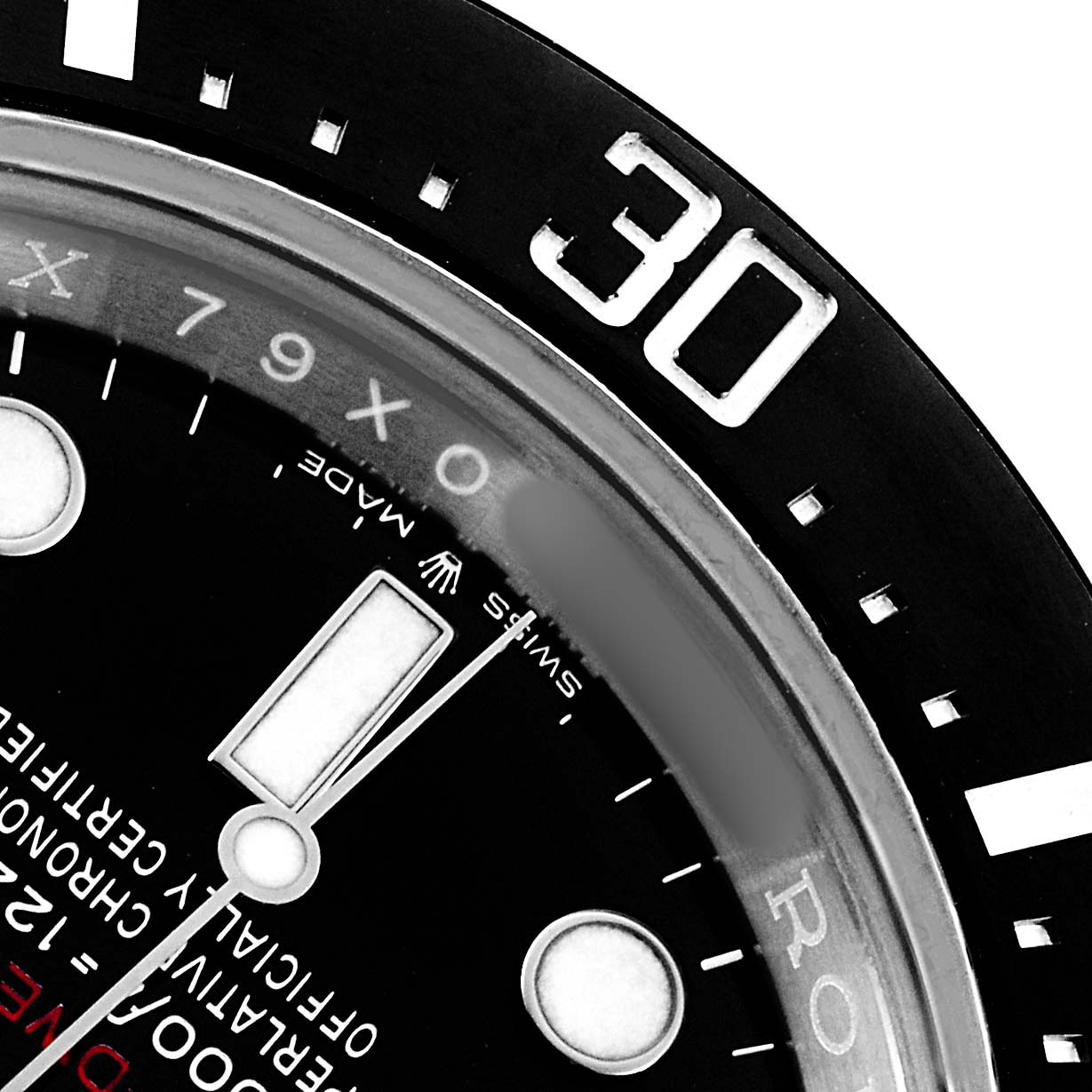 This close-up shows the bezel and dial of a Rolex Sea-Dweller 126600 Men's Stainless Steel Black Dial, highlighting the "30" mark and part of the minute hand.