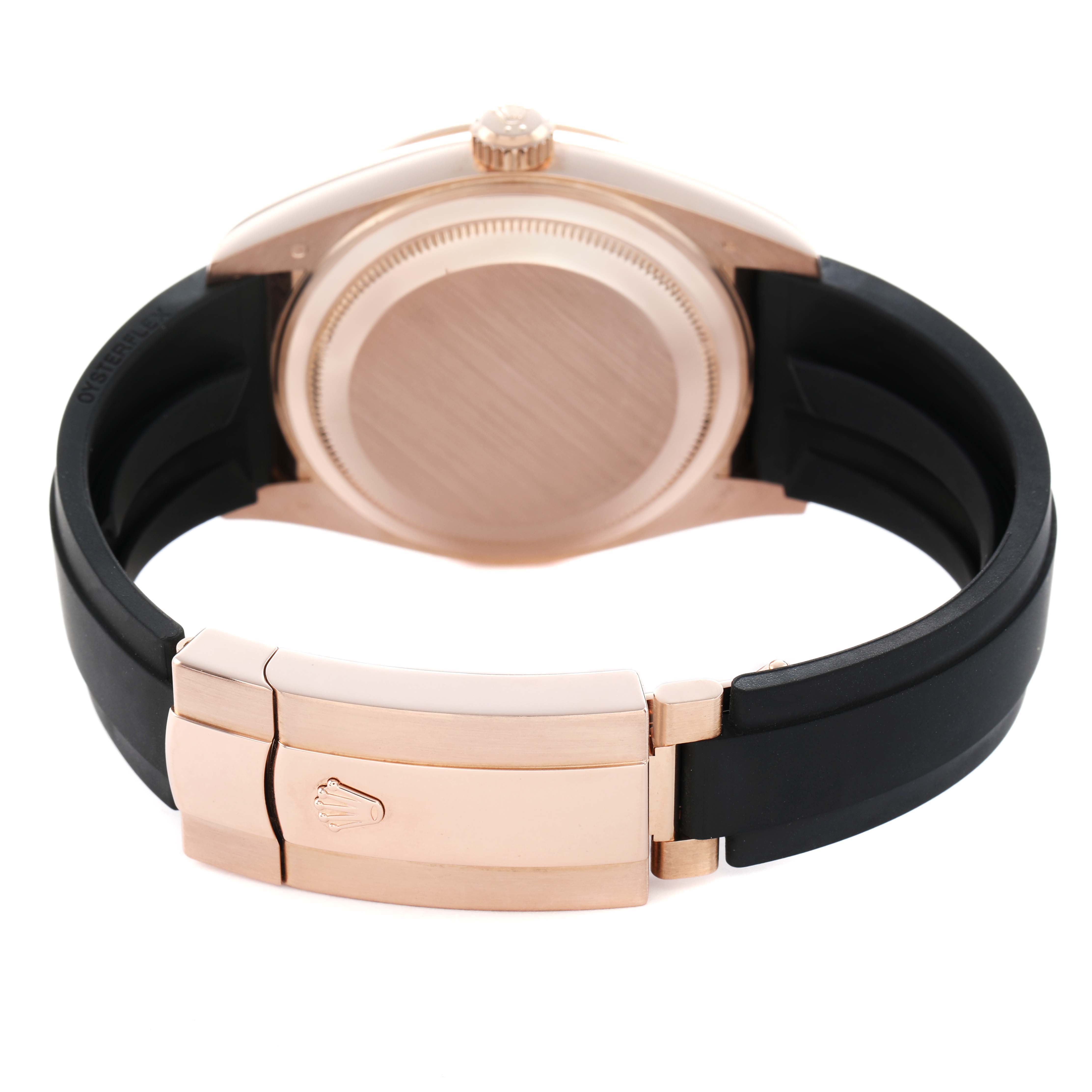 The image shows the back case and clasp of a Rolex Sky-Dweller 326235 Men's Rose Gold Brown Dial, featuring a rose gold tone and a black strap.