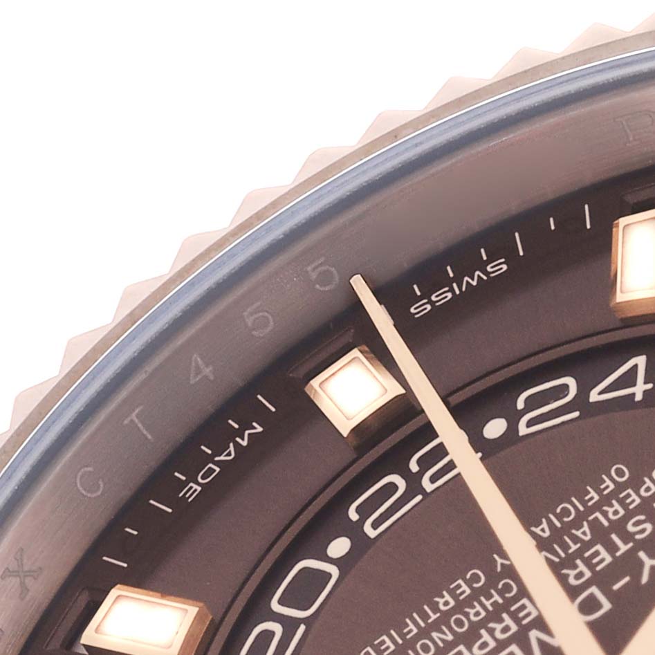 The image shows a close-up of the Rolex Sky-Dweller 326235 Men's Rose Gold Brown Dial's dial, featuring hour markers, the 24-hour ring, and part of the bezel.