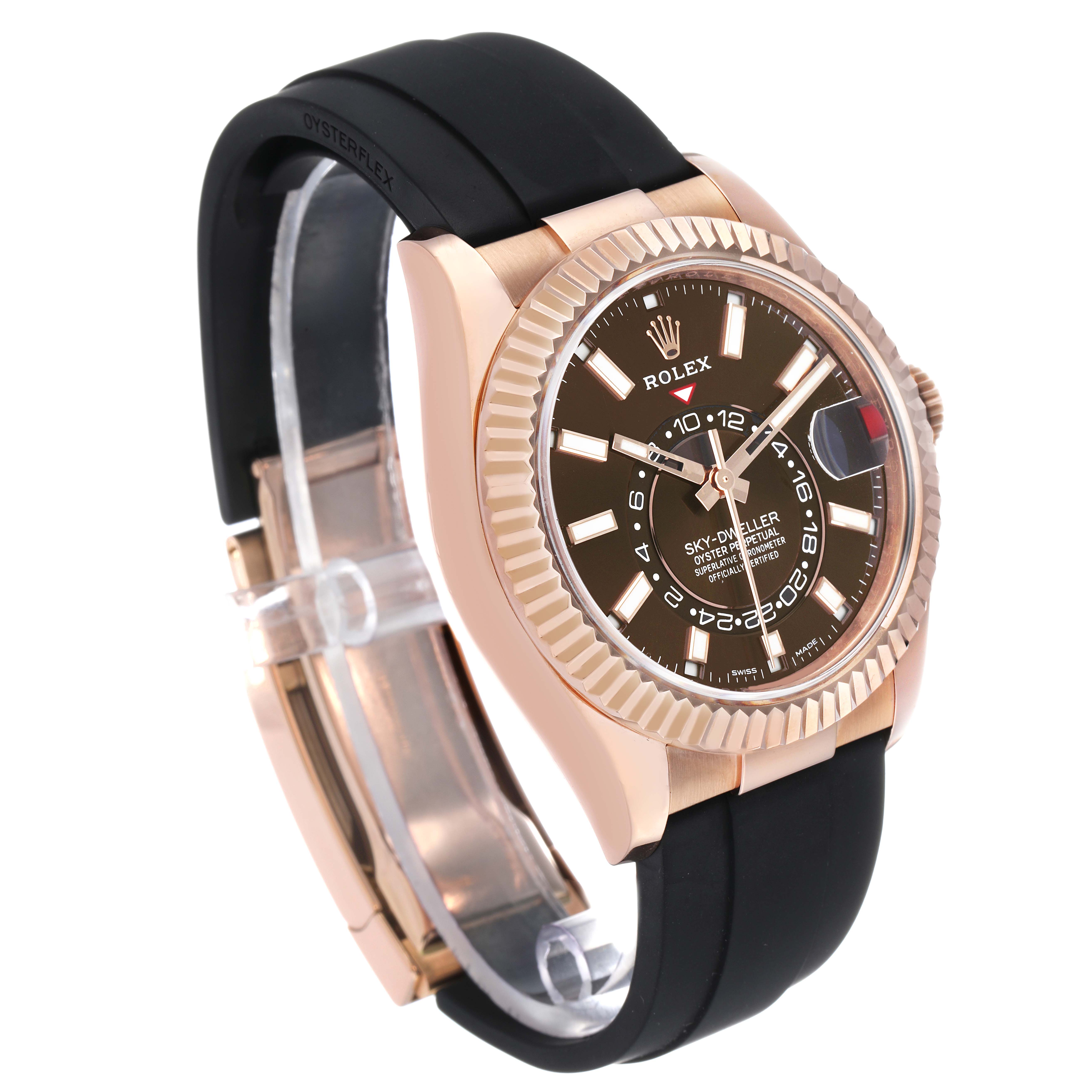 The Rolex Sky-Dweller 326235 Men's Rose Gold Brown Dial is shown in a three-quarter angle, highlighting the dial, Oysterflex strap, and fluted bezel.
